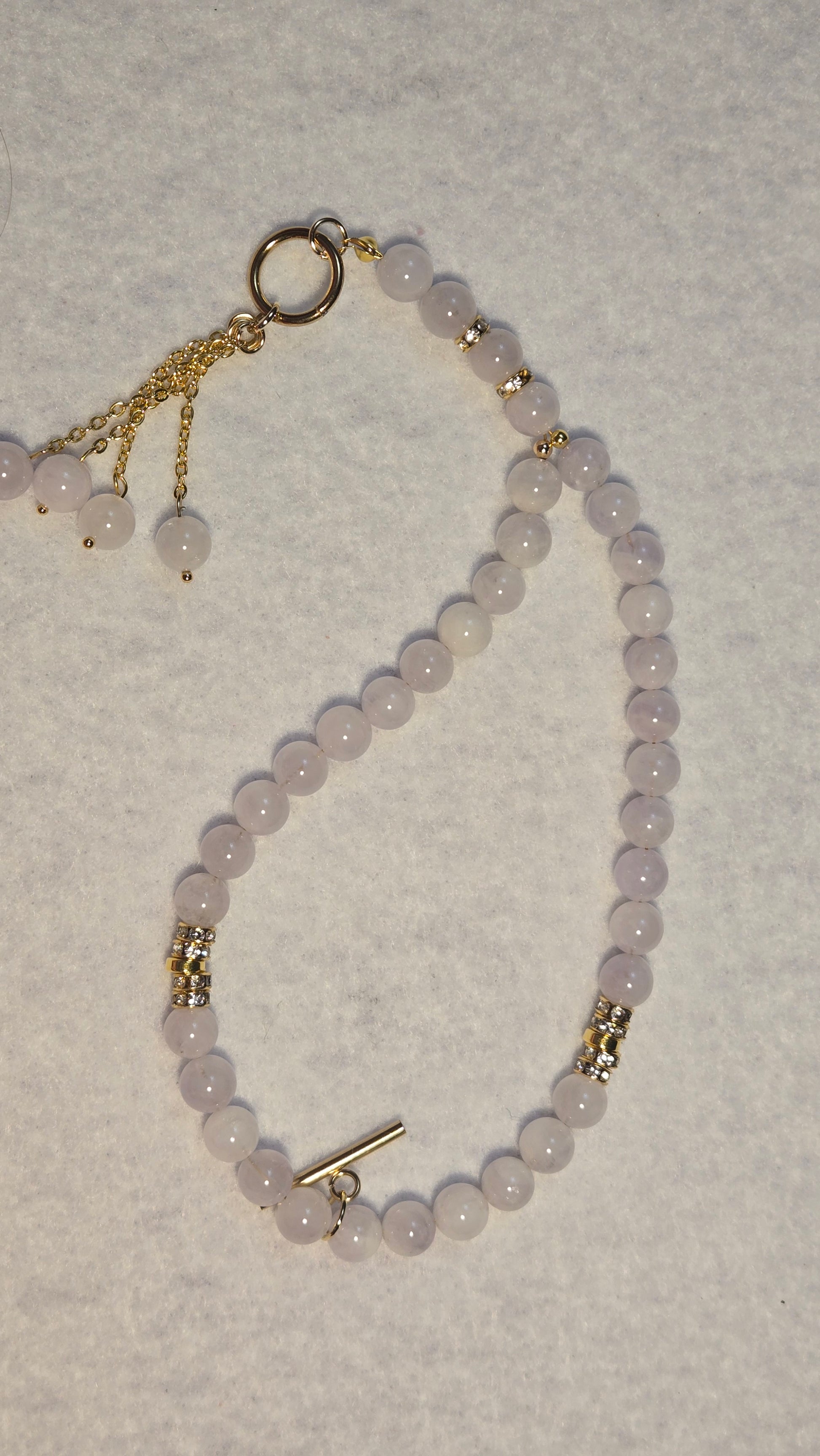 Close-up of genuine 8mm lavender amethyst beads and refined gold-plated accents on the LuluTouch tasbih.