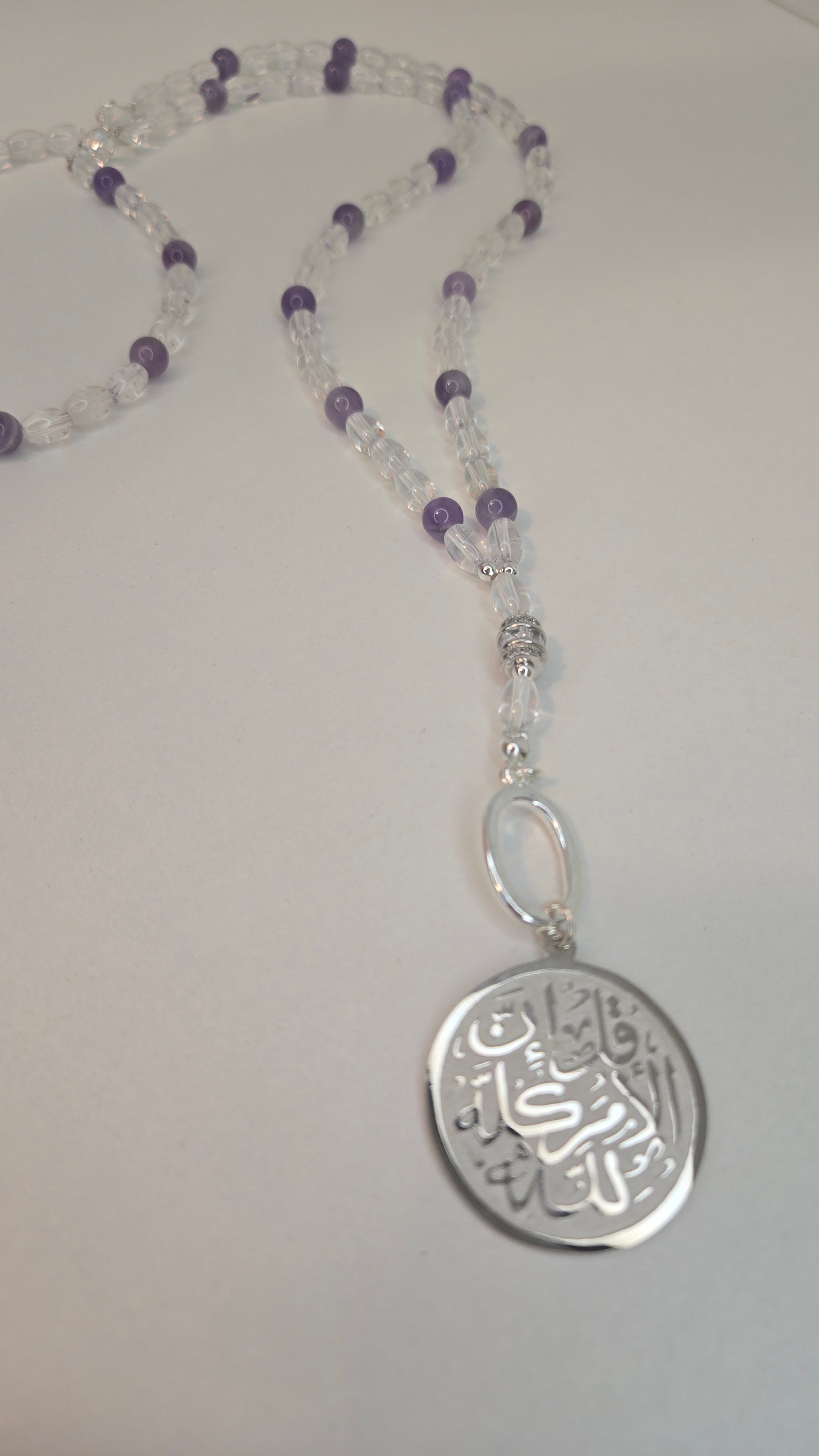 Close-up of natural Amethyst and Crystal Quartz beads