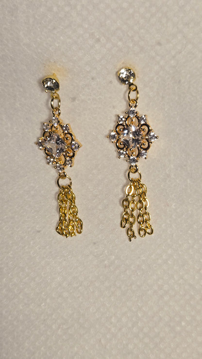 Golden Crystal Tassel Earrings with a crystal in a gold-tone frame and chain tassels, view 2