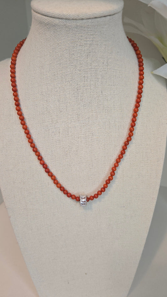 An elegant bracelet featuring warm tiger eye stones, soft pearls, and refined gold details for a bold yet graceful look.