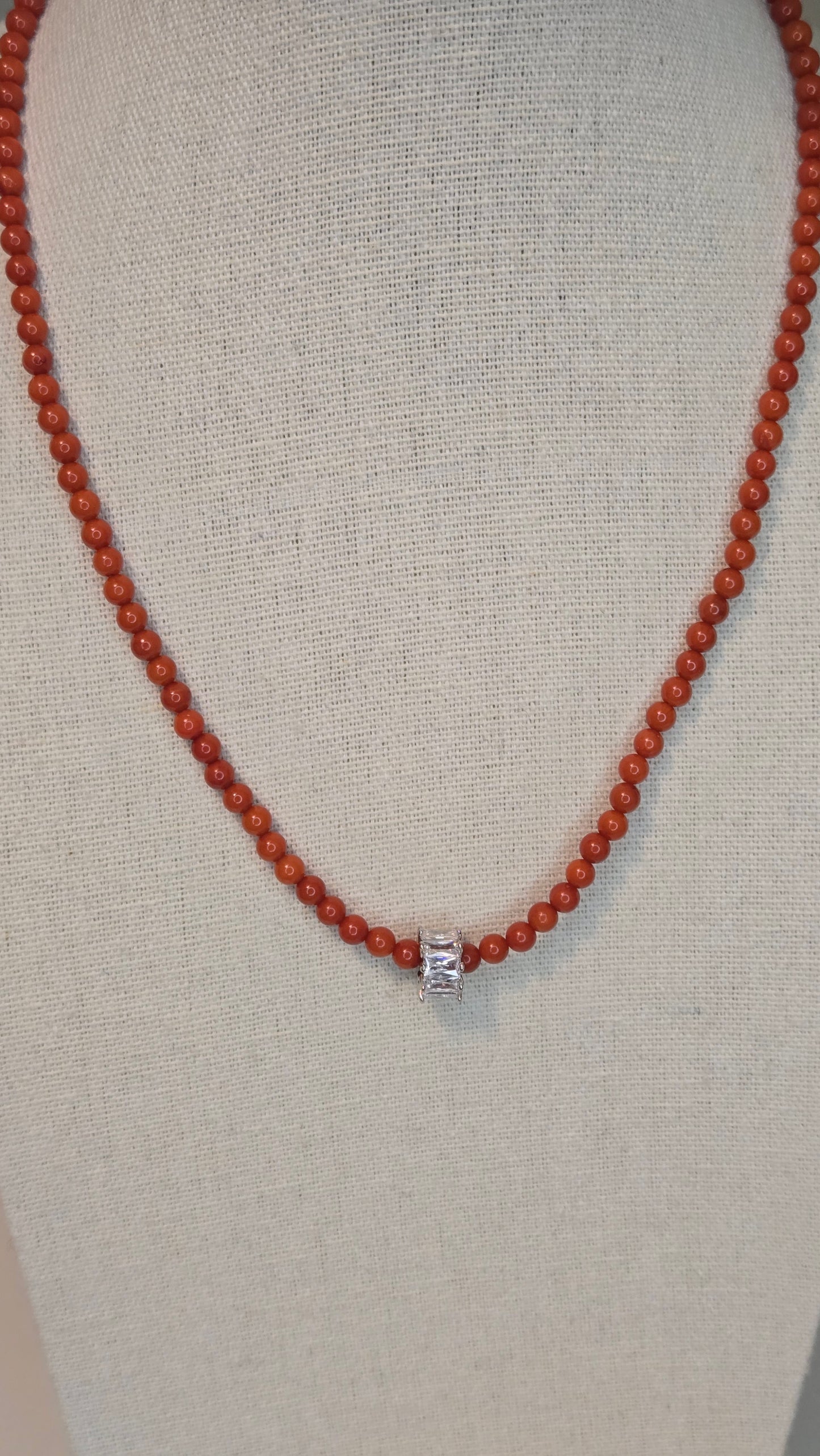 Elegant tiger eye and freshwater pearl bracelet styled with a chic outfit.