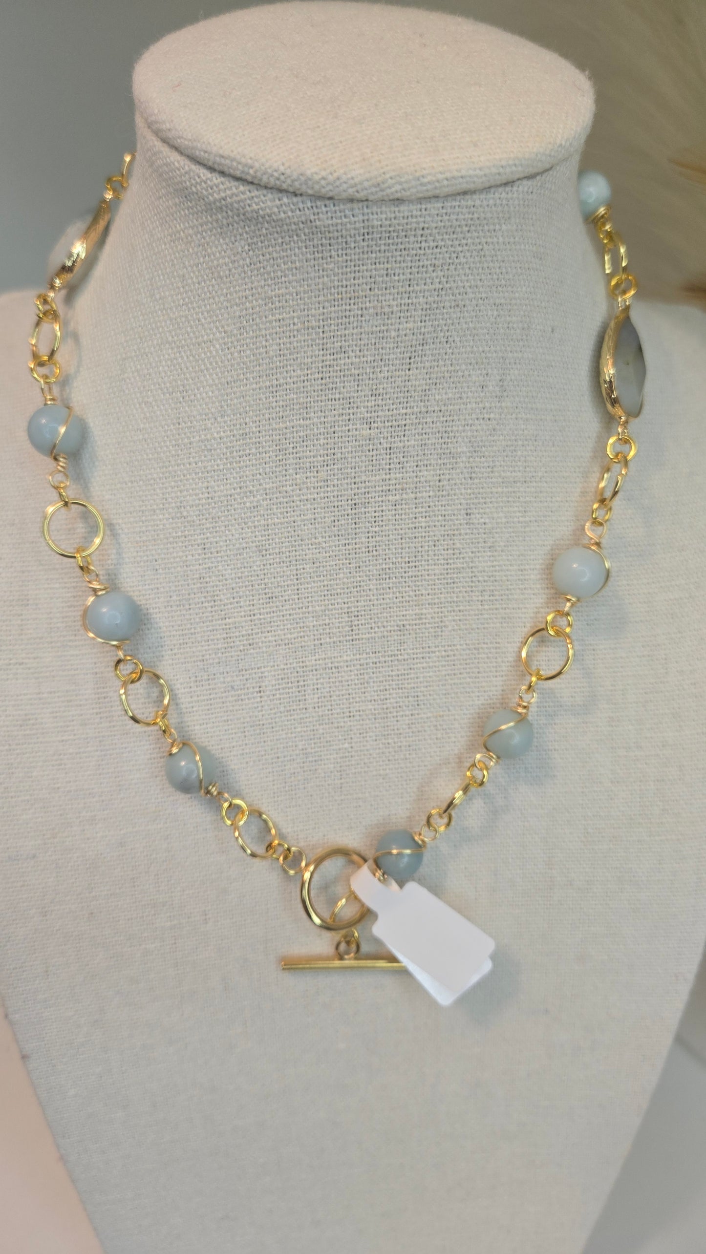 Close-up of Amazonite & Agate Necklace with soft gold accents on a white background, showcasing blue-green amazonite beads and banded agate.