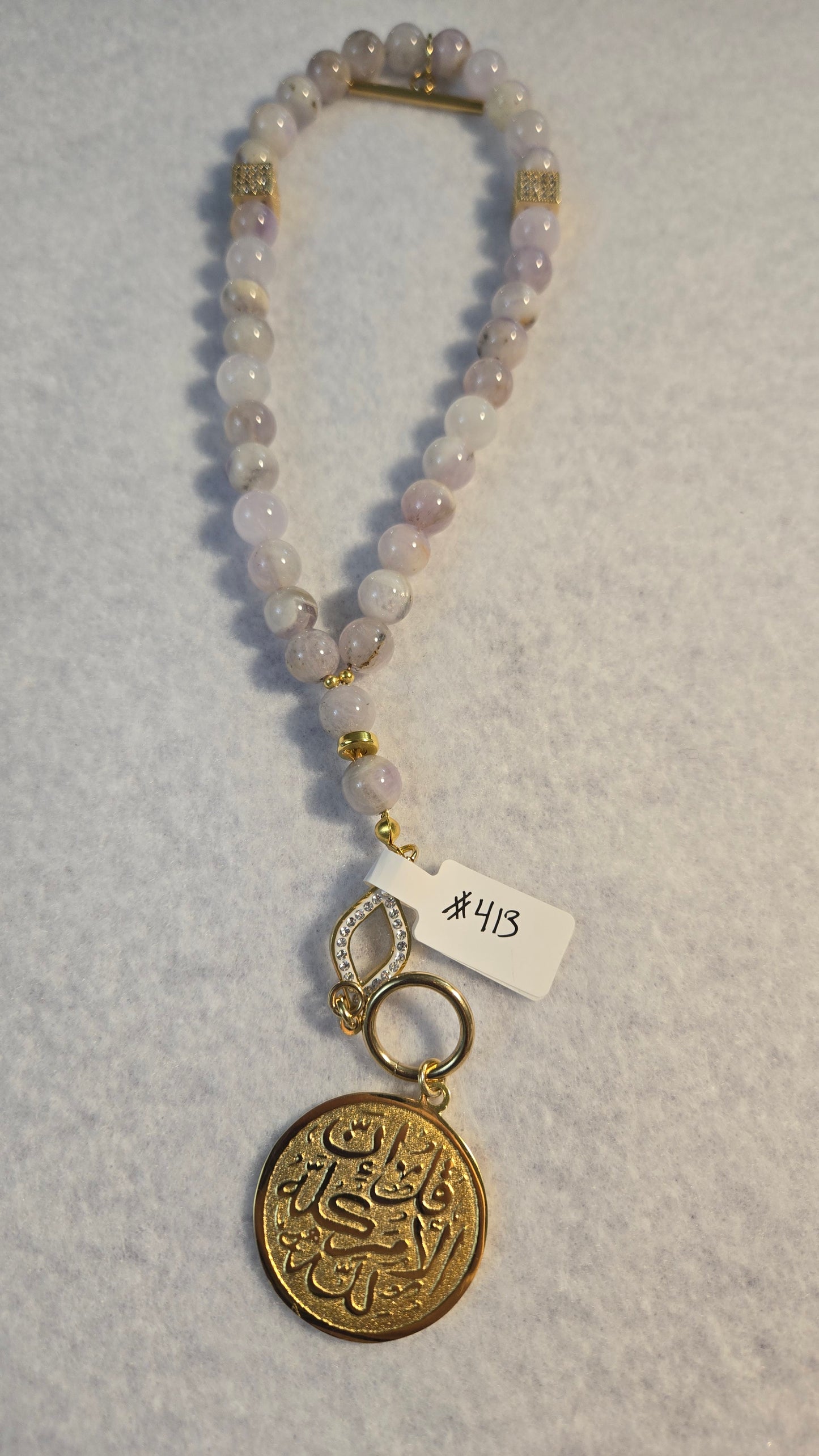 Amethyst Whisper Tasbih handmade bracelet with natural light-purple beads and gold accents