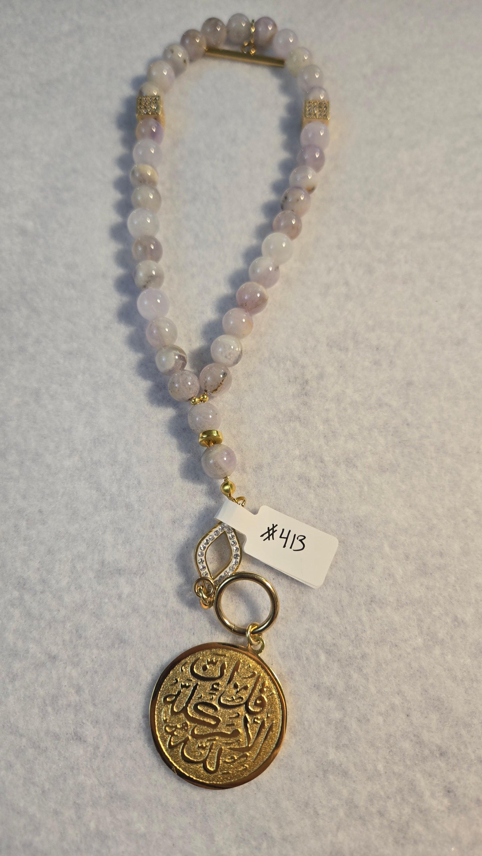 Amethyst Whisper Tasbih handmade bracelet with natural light-purple beads and gold accents