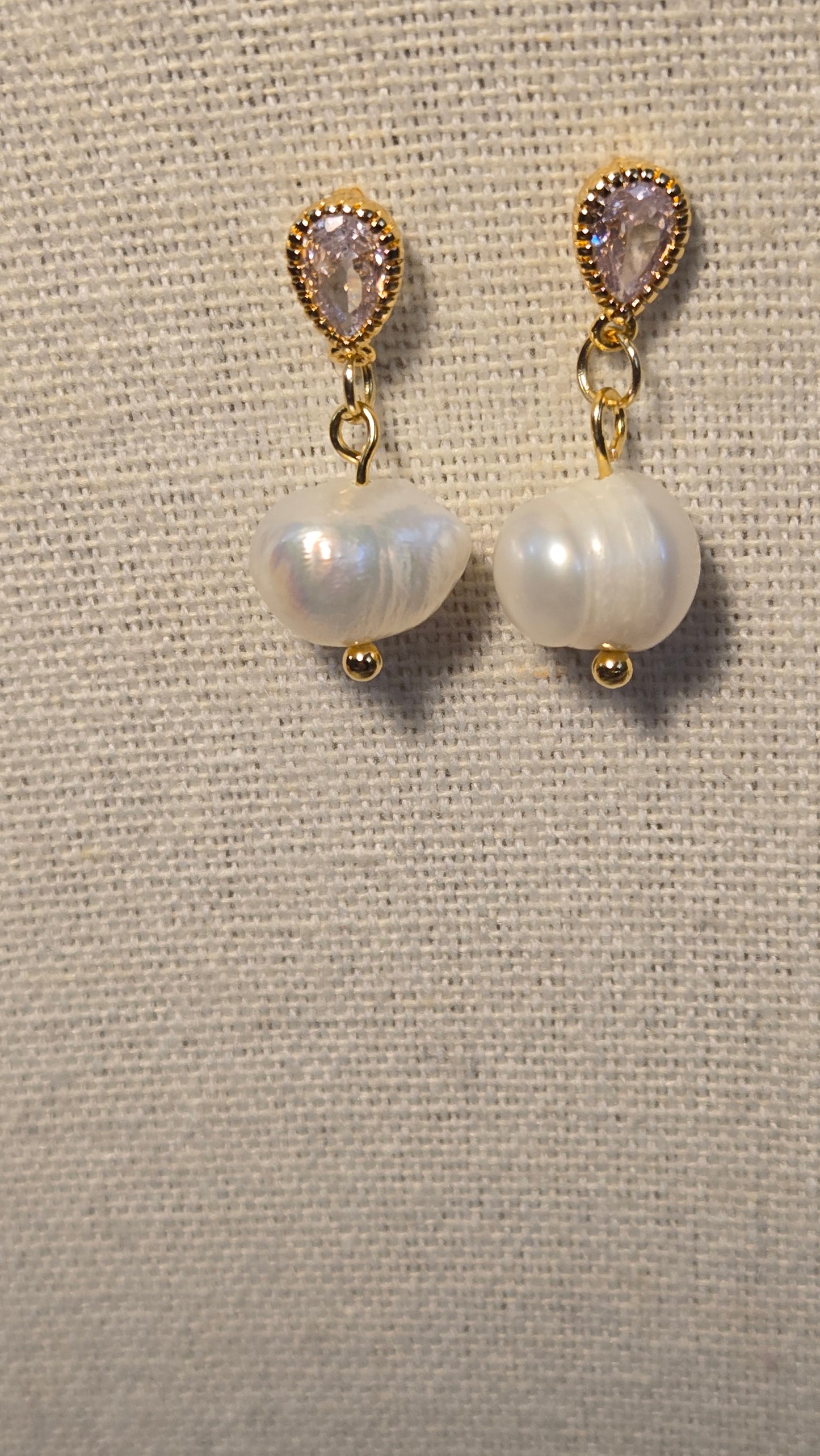 Close-up of Dew Pearl Earrings showcasing the lustrous pearls