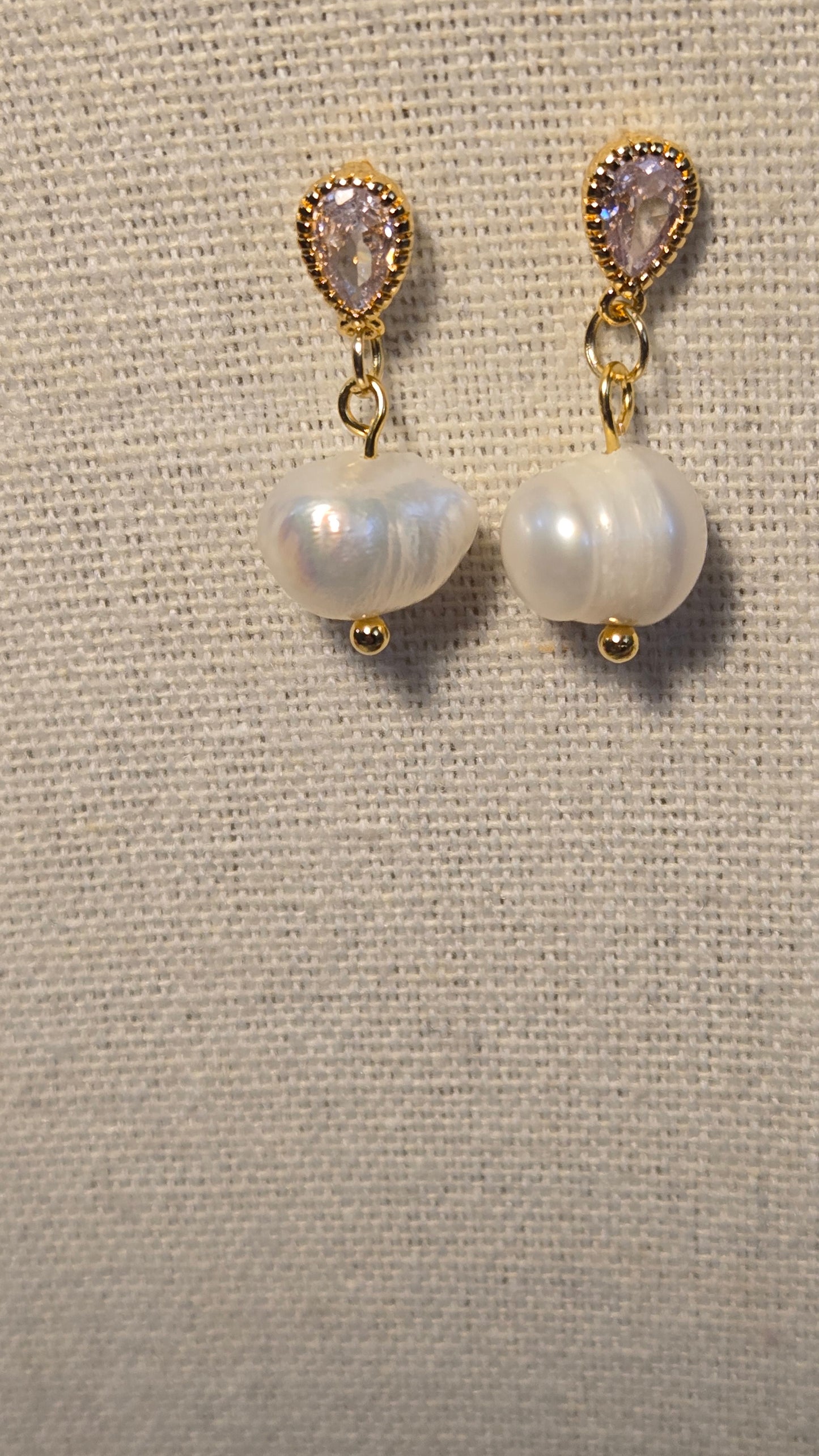Dew Pearl Earrings displayed elegantly on a soft background