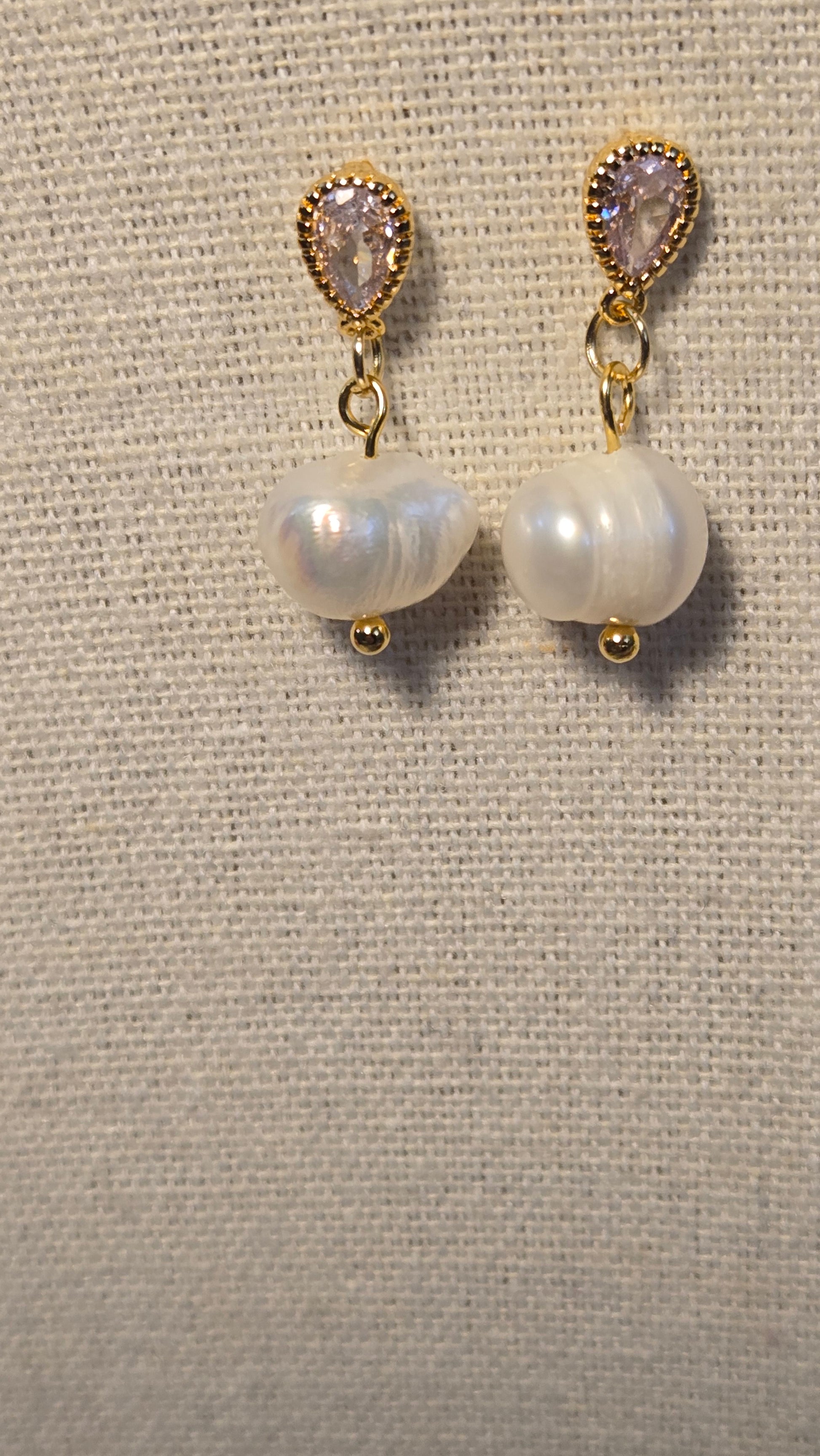 Dew Pearl Earrings displayed elegantly on a soft background