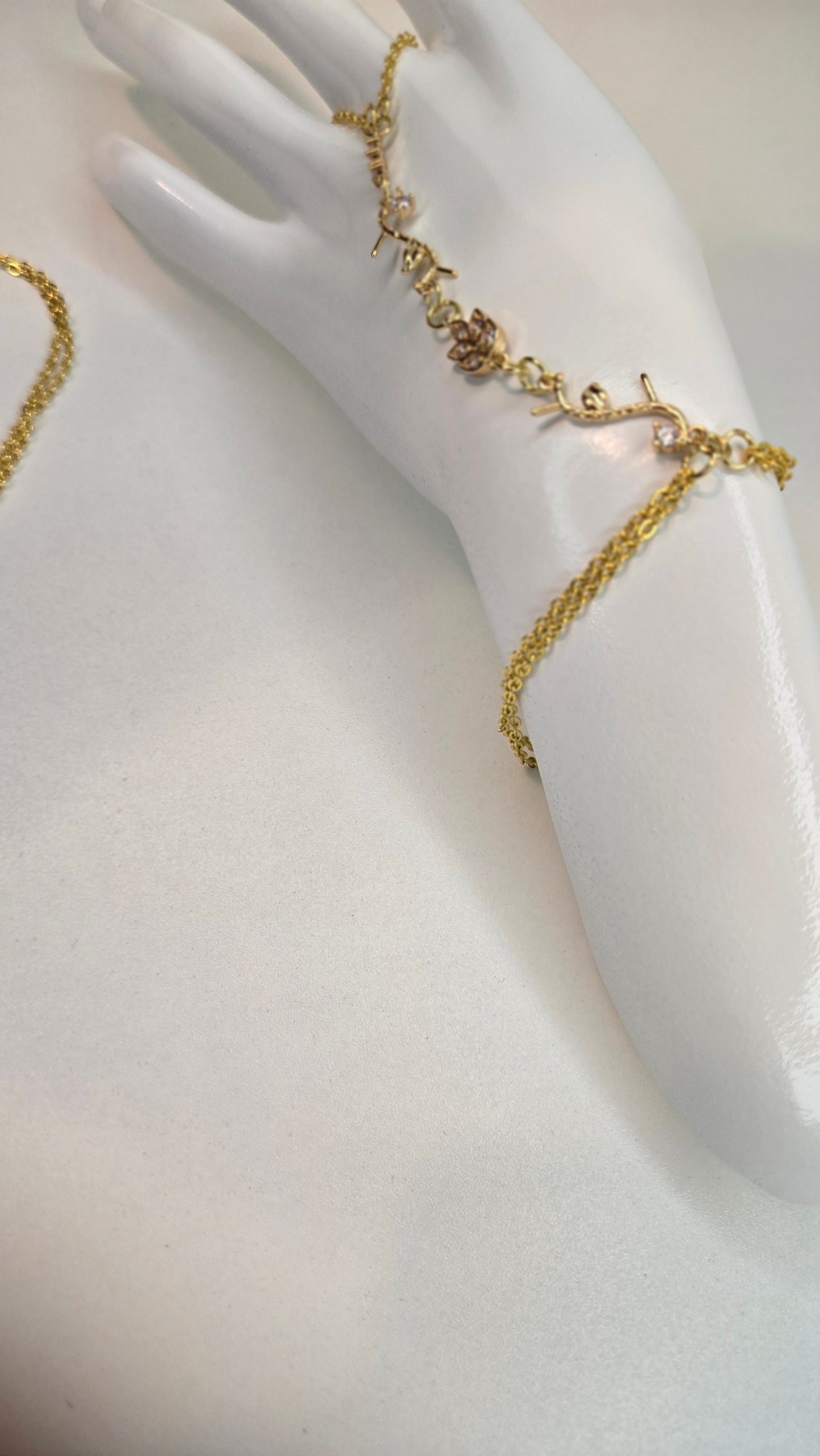 Hand showing off the Elegant Hand Chain Bracelet in natural light