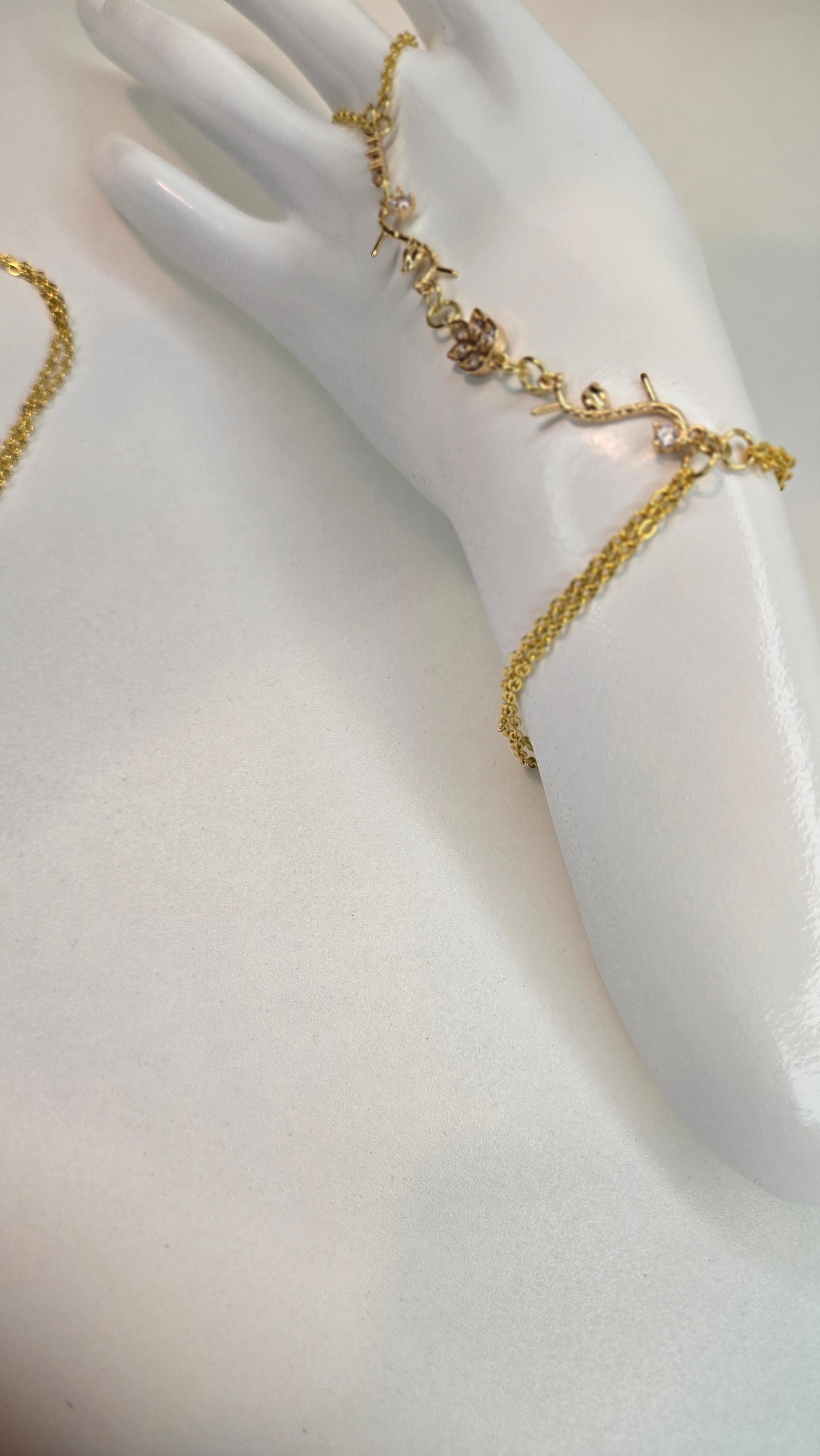 Hand showing off the Elegant Hand Chain Bracelet in natural light