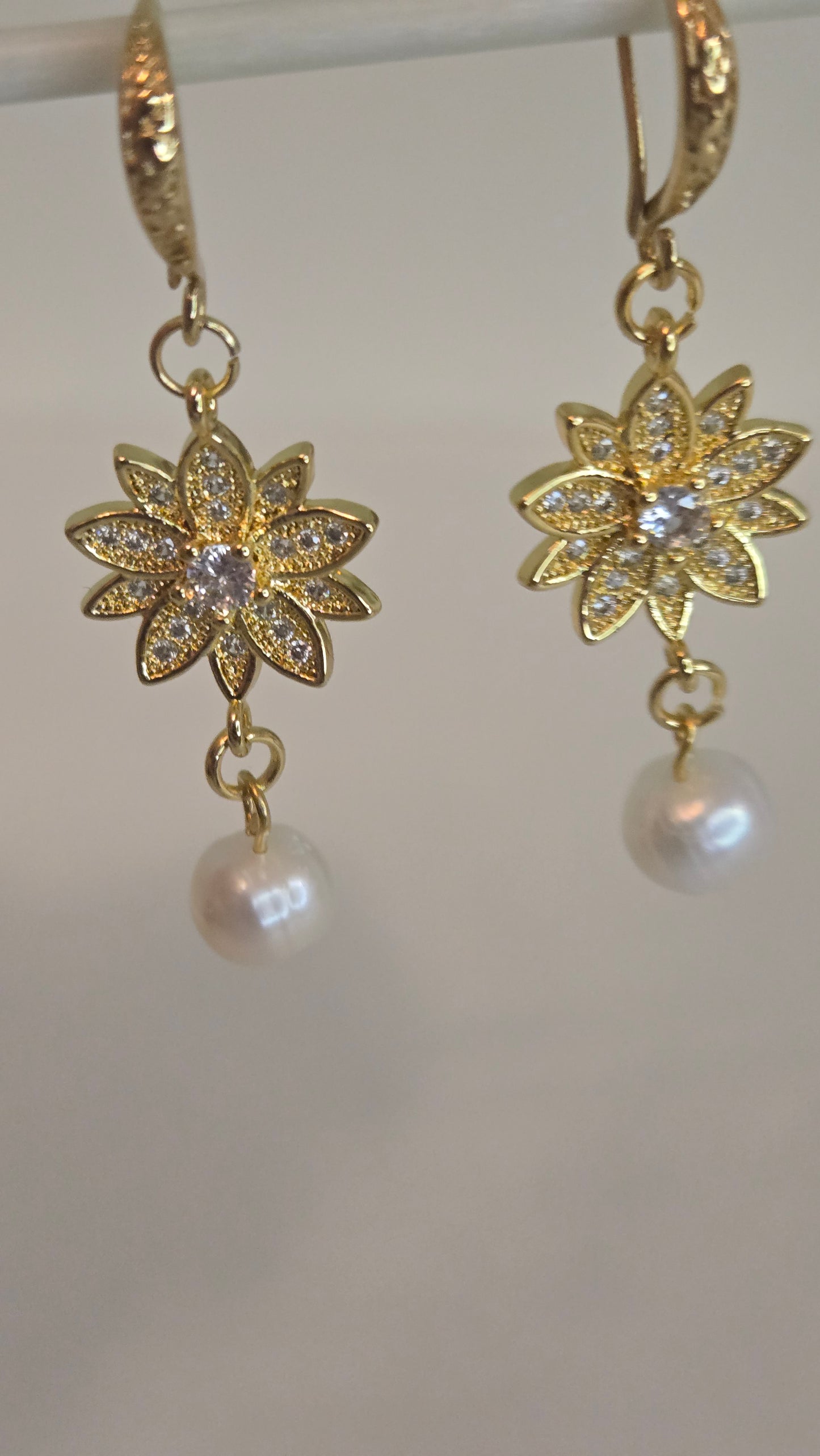 Dazzling Pearl Bloom Earrings worn by a model