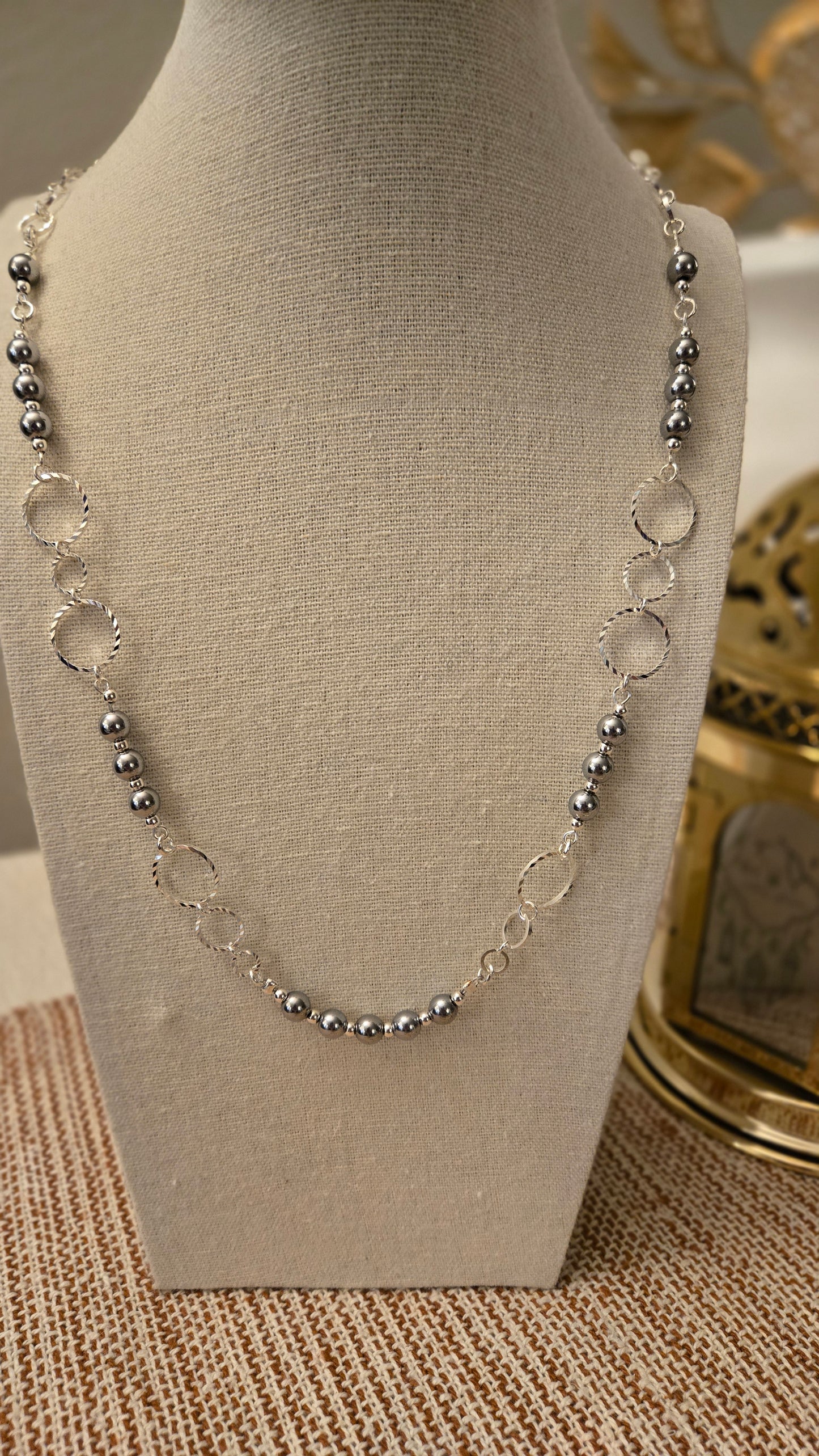Model wearing Natural Hematite Necklace with casual attire