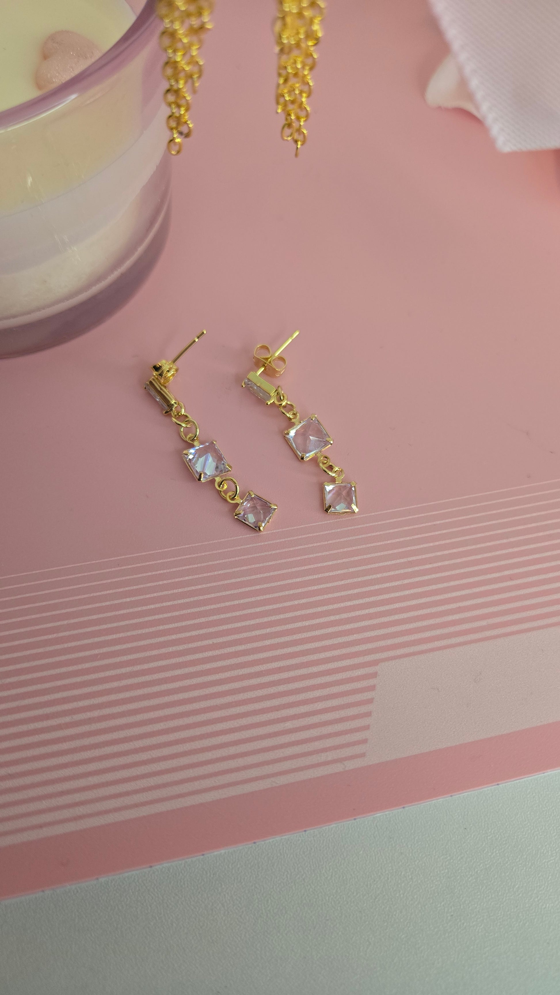 Distinctive gold earrings reflecting light beautifully