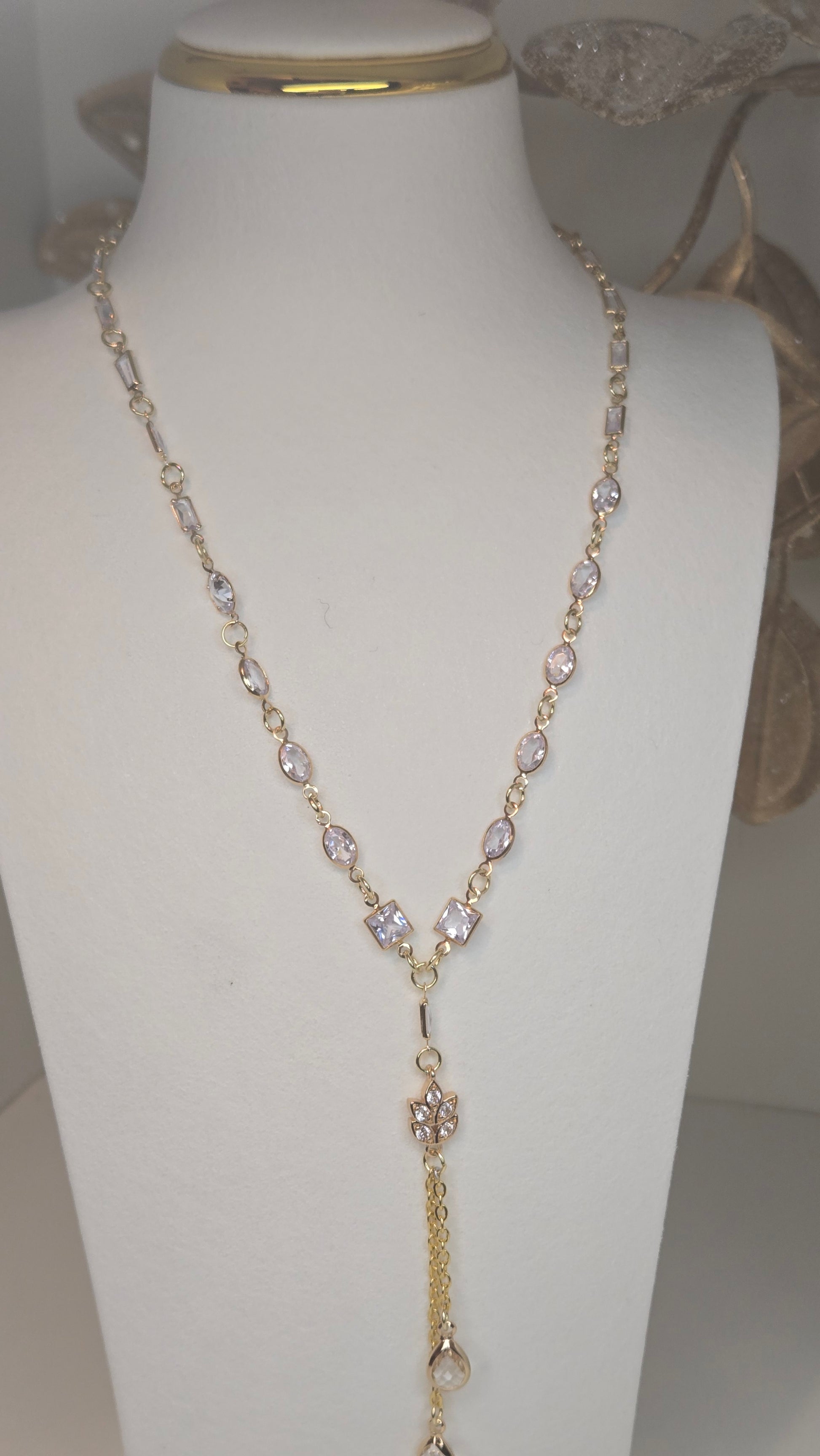 Elegant Luminous Charm Necklace showcased on a display