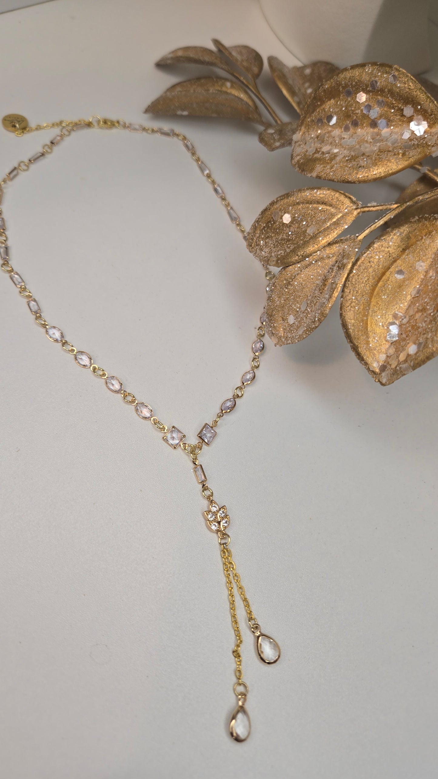 Stylish Luminous Charm Necklace laid on a textured surface
