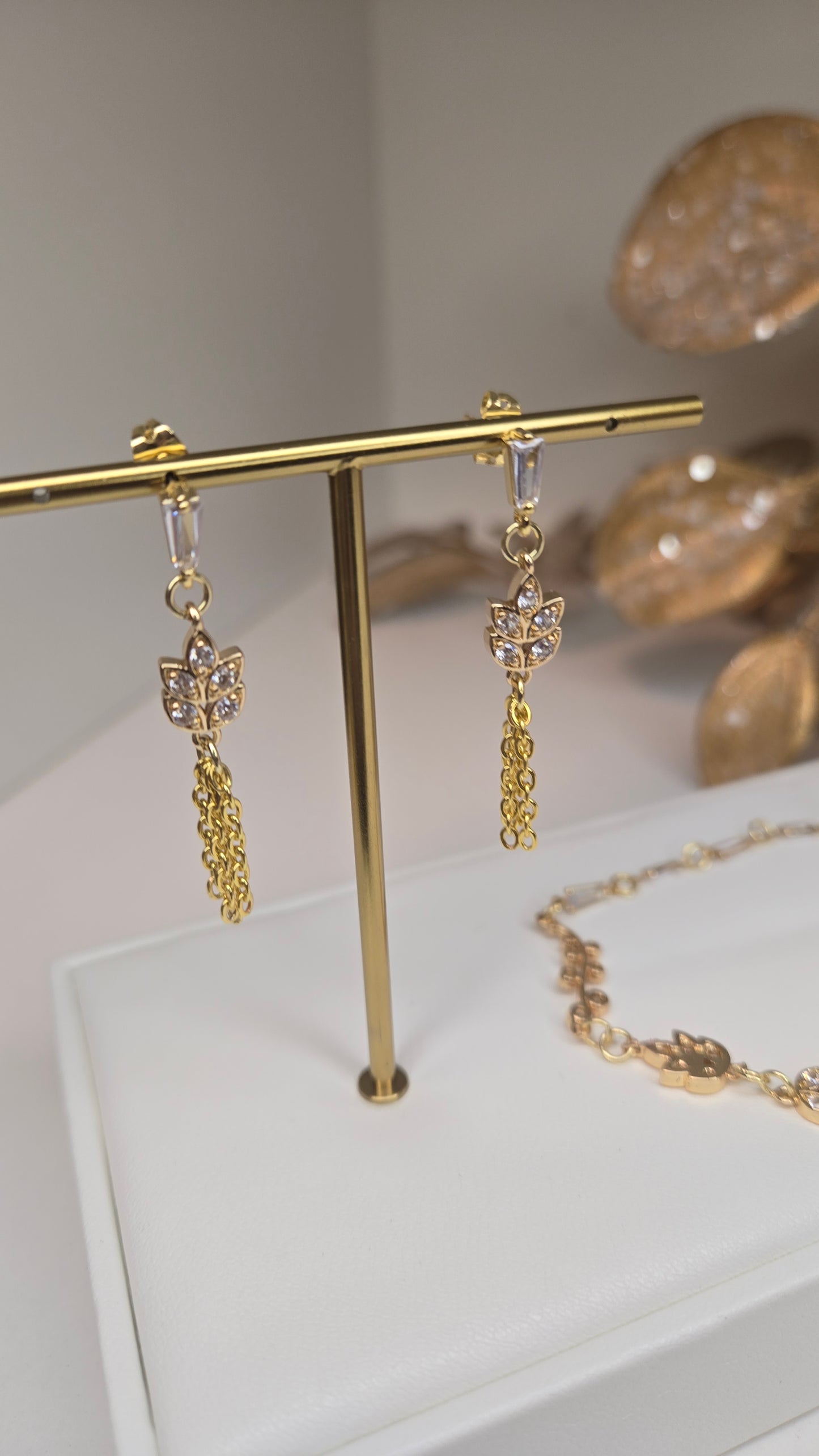 Close-up of the delicate floral-inspired earrings from the Elegance Whisper set