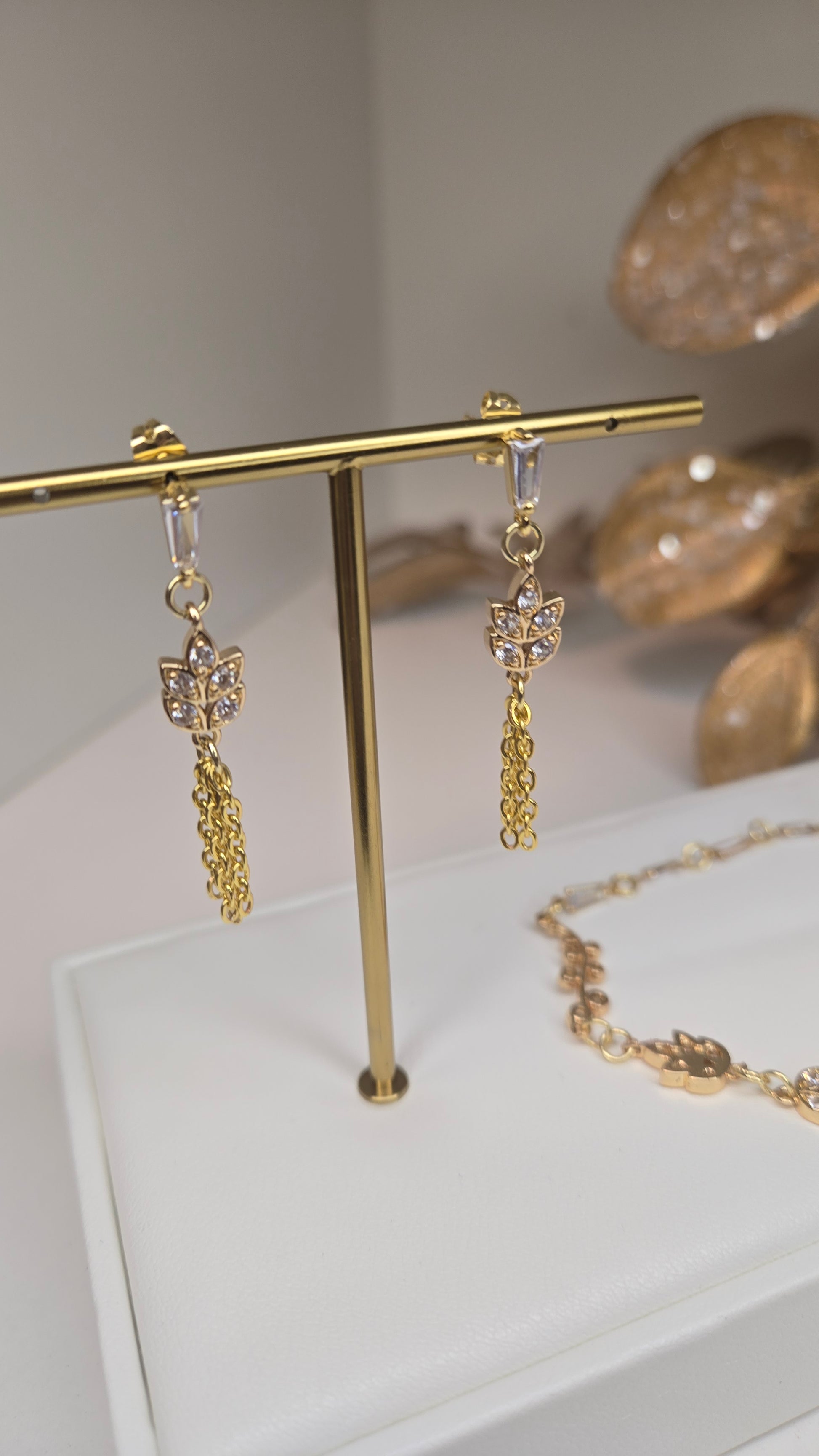Close-up of the delicate floral-inspired earrings from the Elegance Whisper set