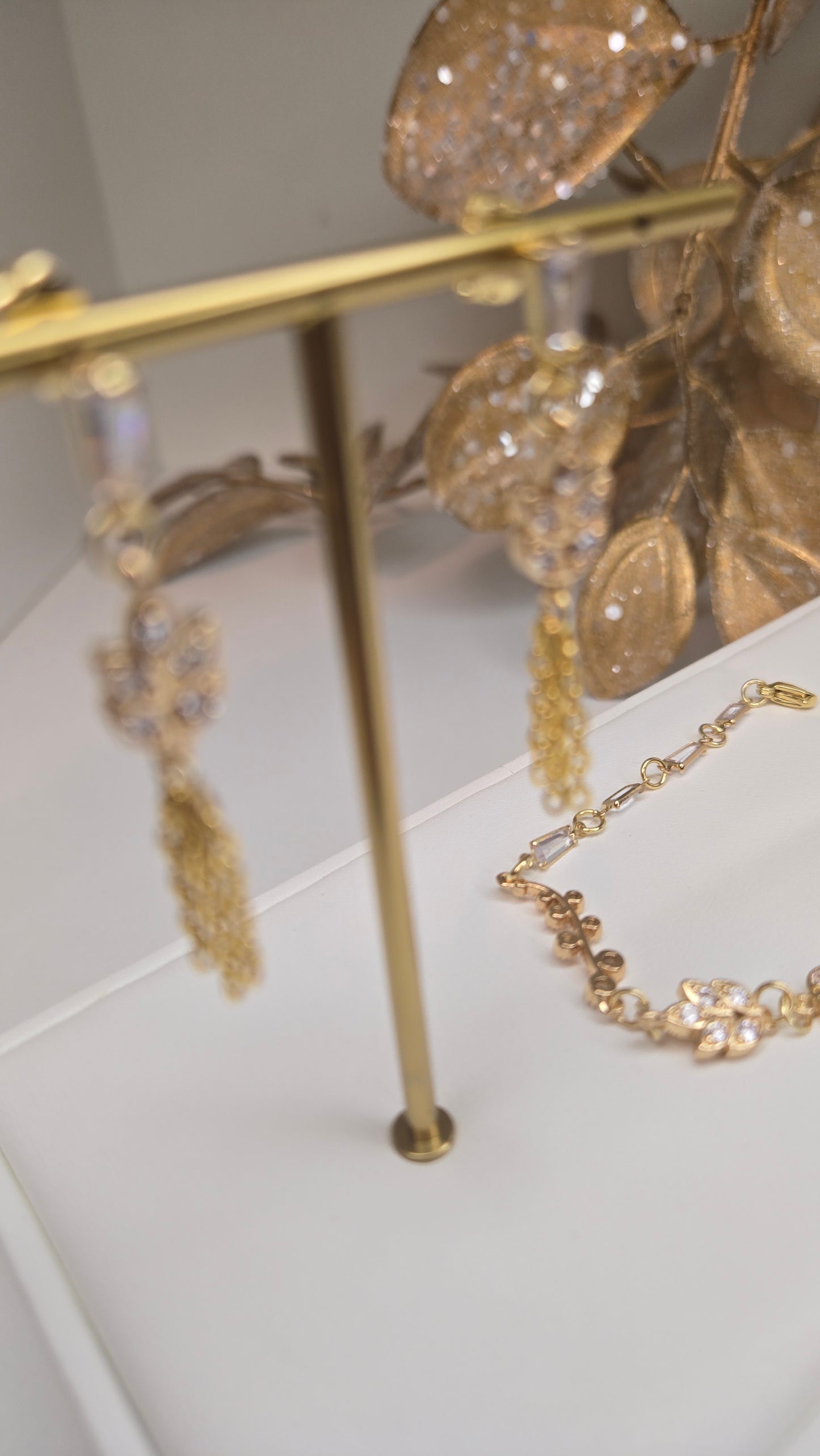 Model wearing the Elegance Whisper dangle earrings, showcasing their graceful movement