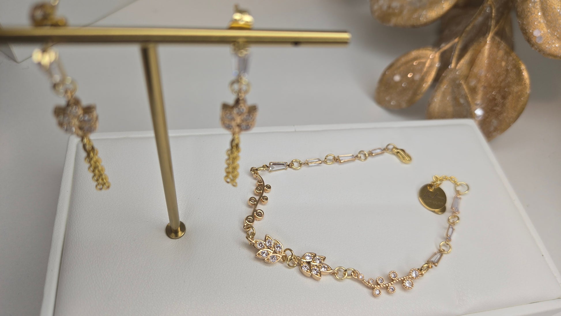 Both Elegance Whisper bracelet and earrings styled together on a model for a complete look