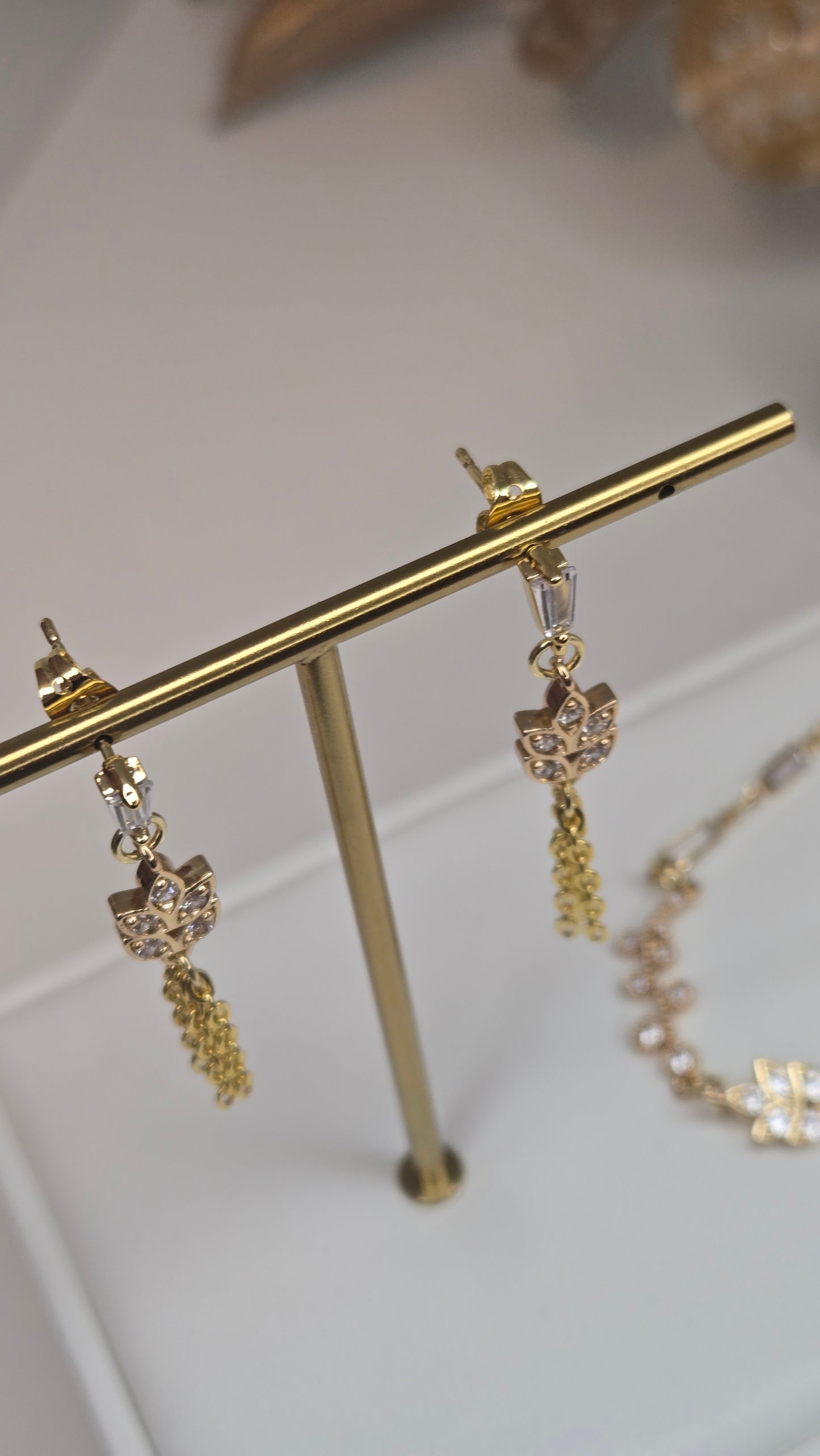Detail shot of the intricate floral etching on the unique jewelry pieces