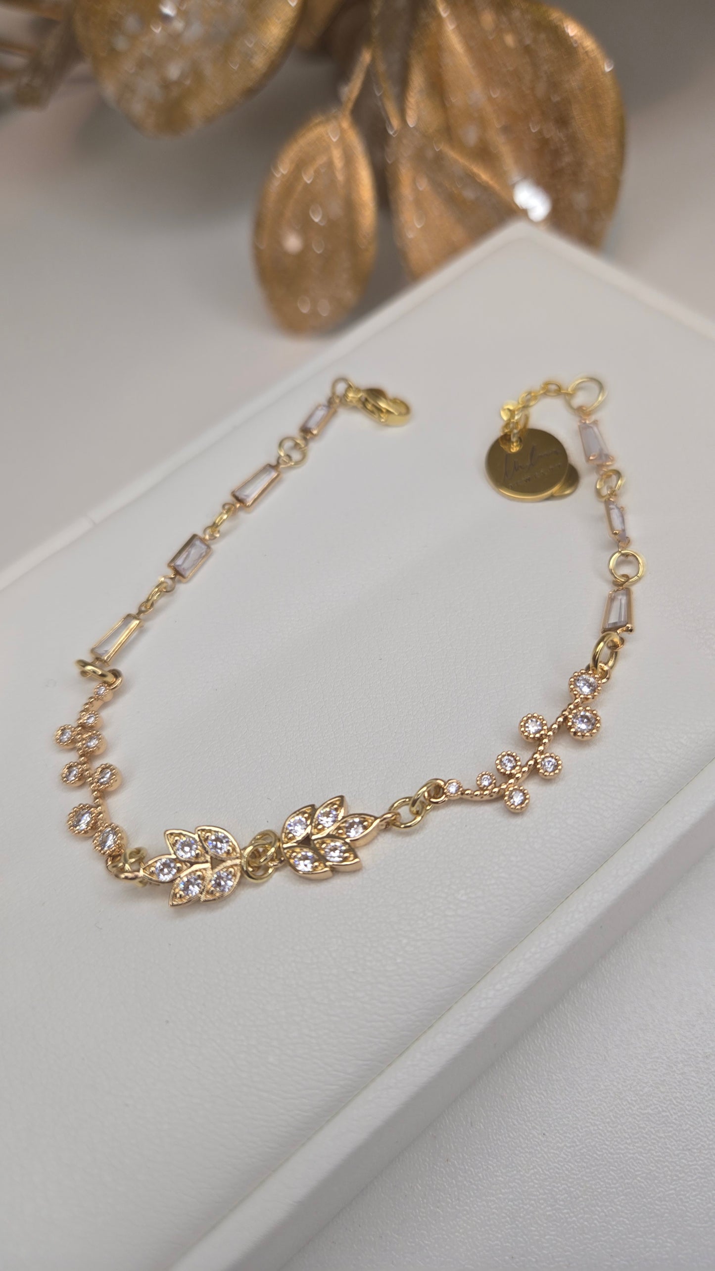 Side profile of the elegant dangle earrings, emphasizing their delicate design
