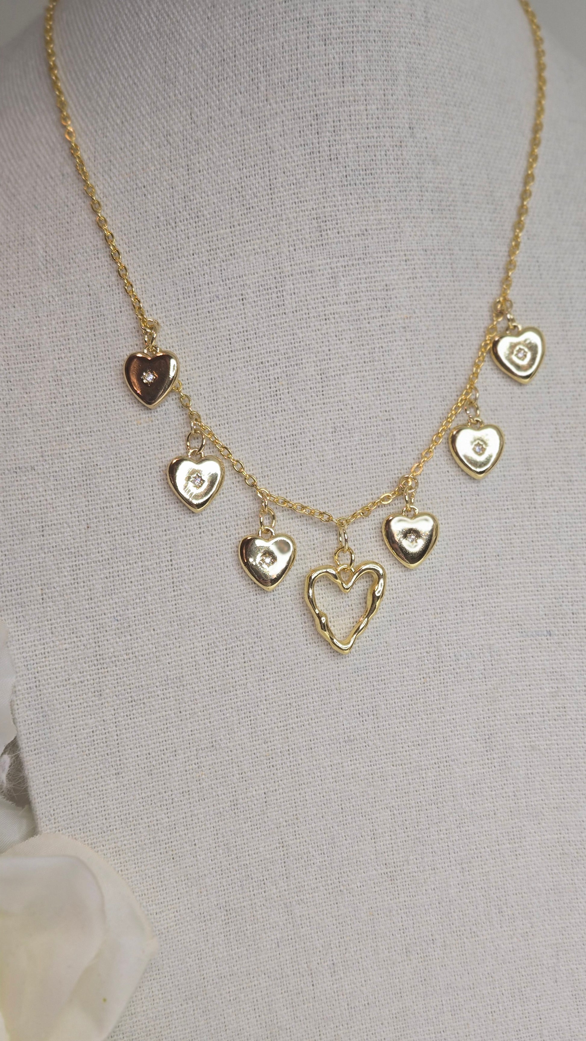 Golden Heart Charm Necklace showcased in a stylish jewelry box