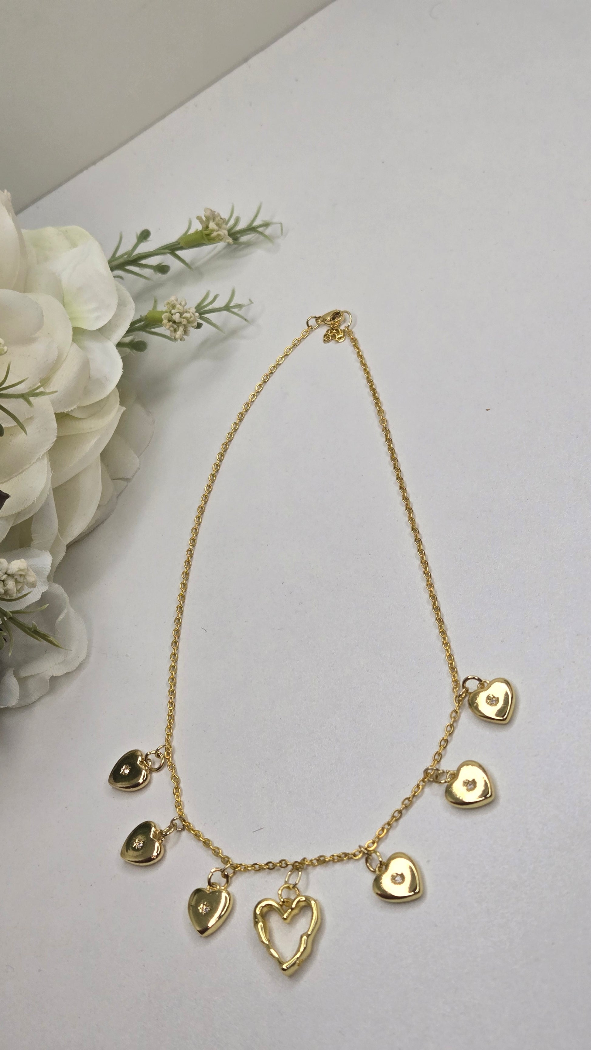 Golden Heart Charm Necklace with a focus on the heart charm