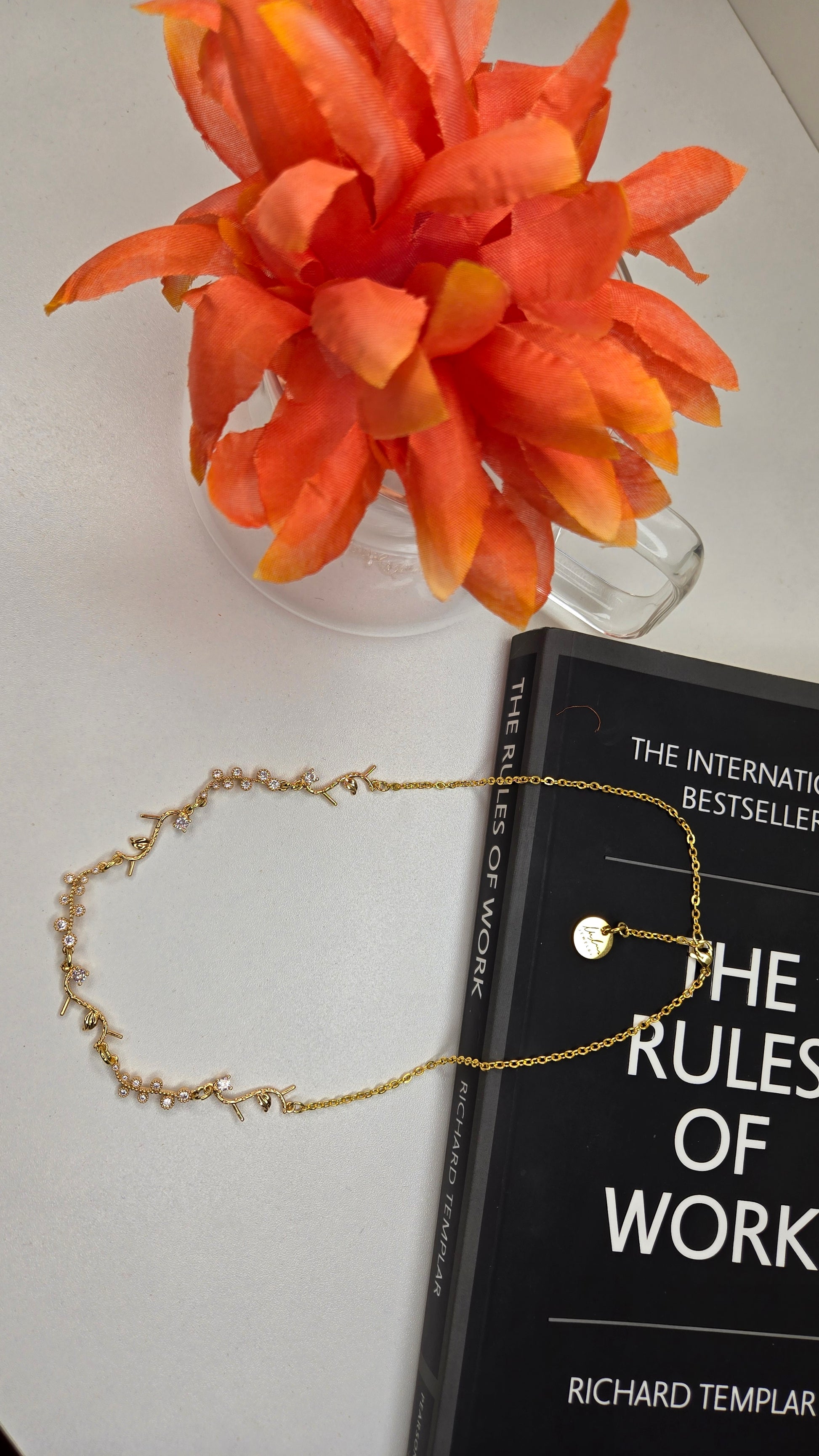 Golden Branch Necklace draped elegantly on soft fabric
