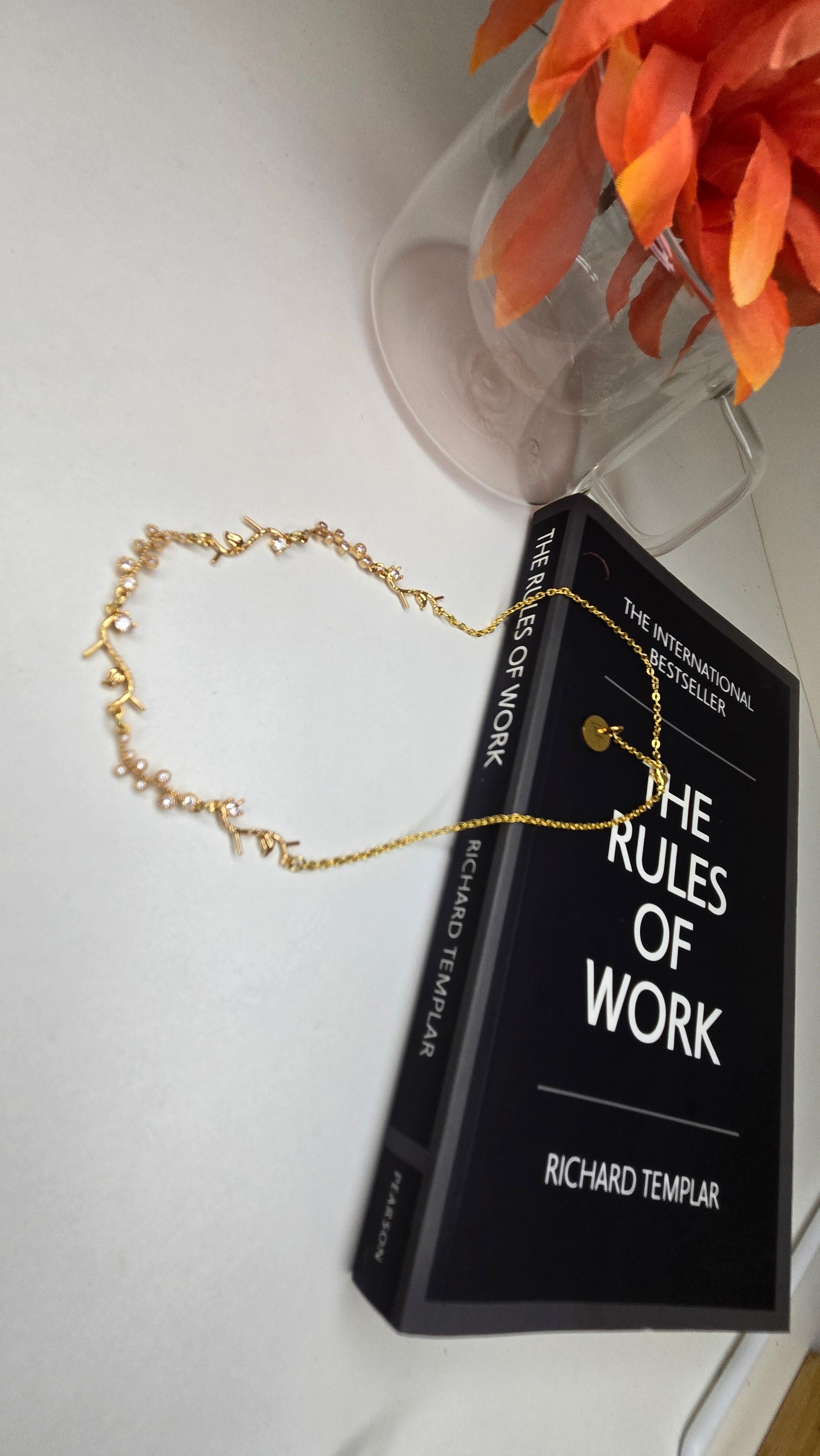 Golden Branch Necklace presented on a stylish jewelry stand