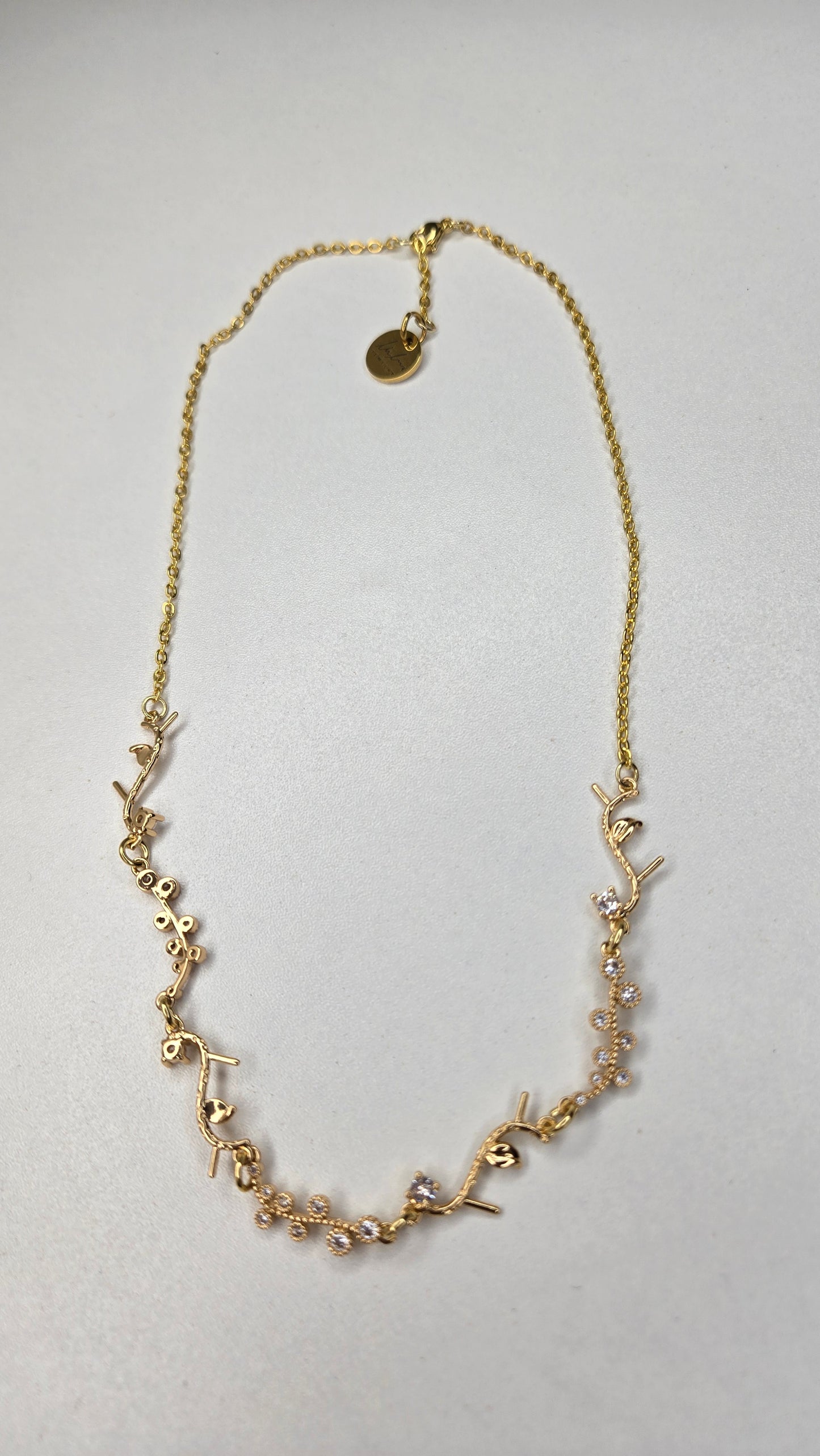 Golden Branch Necklace displayed with a soft focus background