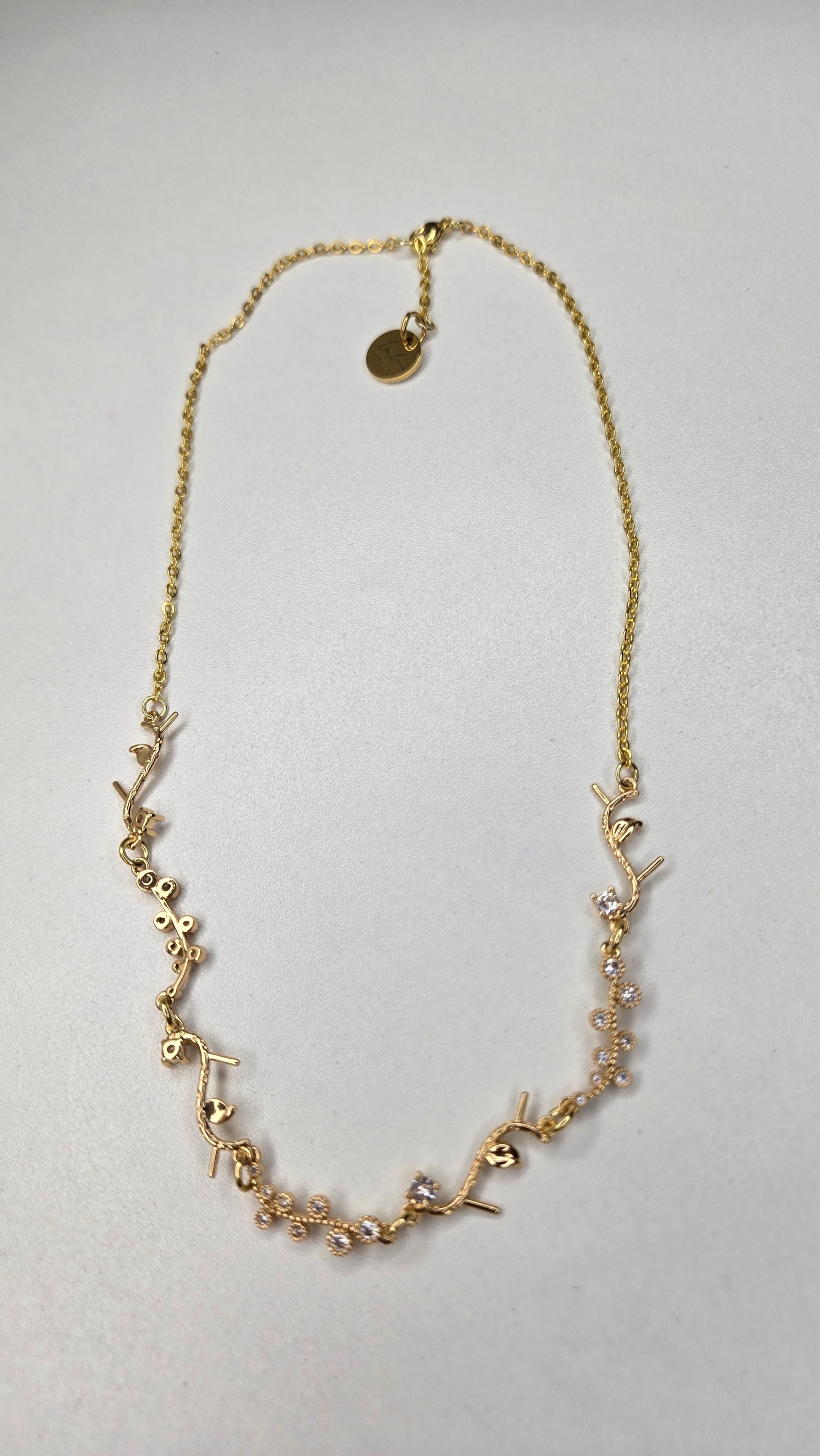 Golden Branch Necklace displayed with a soft focus background