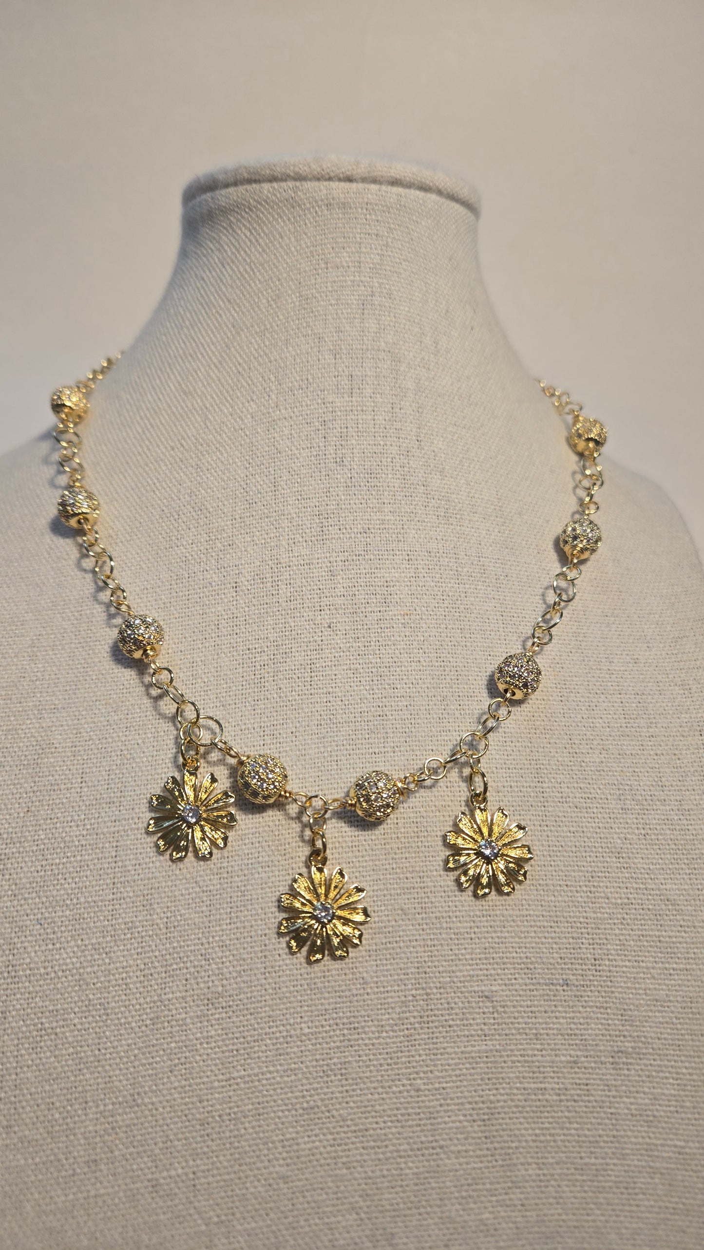 Textured beads and floral details on Bloom Radiance Necklace