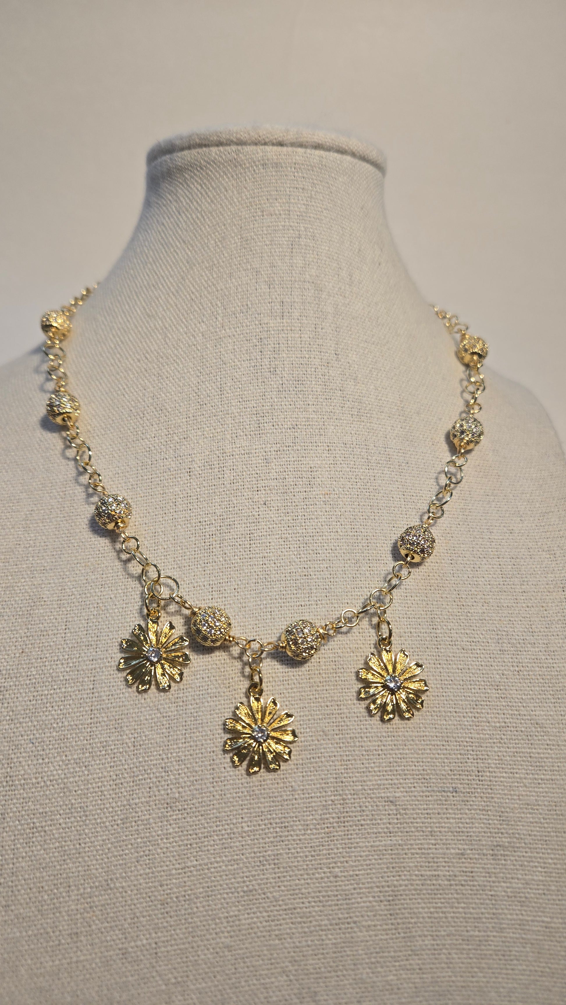 Textured beads and floral details on Bloom Radiance Necklace