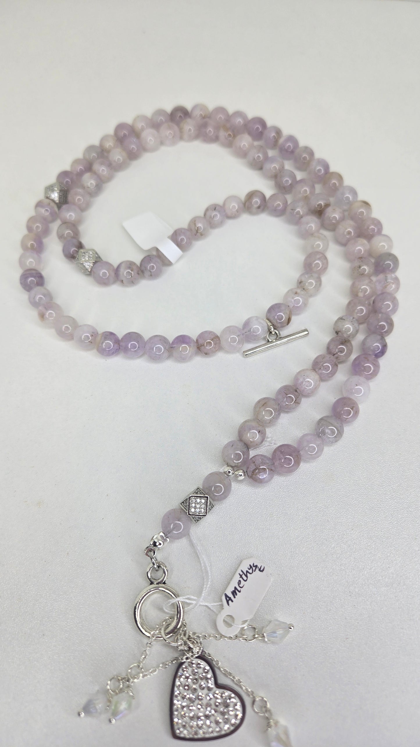 A luxurious tasbih crafted with elegant red jade stones and gold zircon-studded accents for a refined and sophisticated finish. The rich red tones combined with sparkling gold details create a timeless and graceful look.