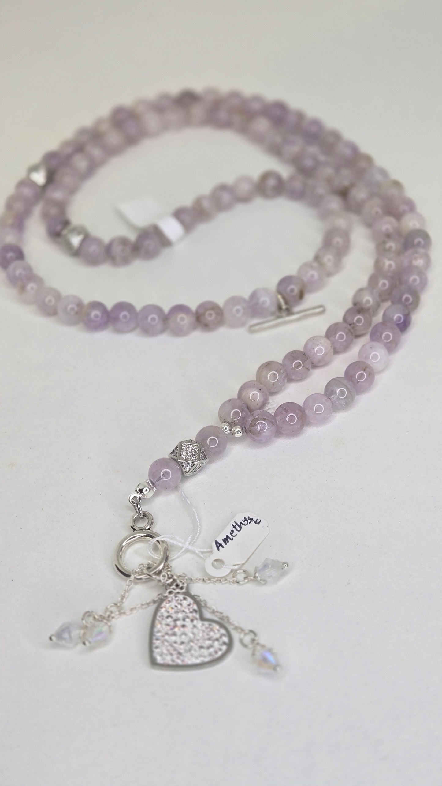 A luxurious tasbih crafted with elegant red jade stones and gold zircon-studded accents for a refined and sophisticated finish. The rich red tones combined with sparkling gold details create a timeless and graceful look.