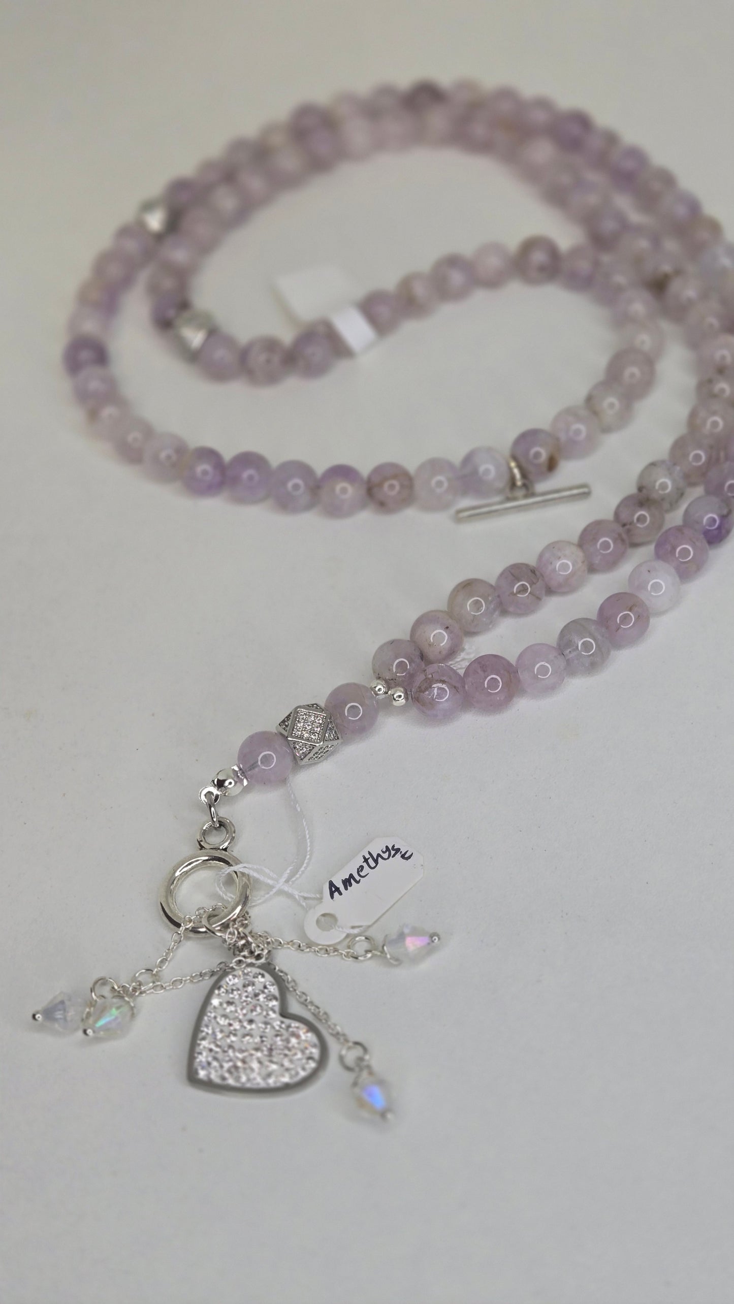 A luxurious tasbih crafted with elegant red jade stones and gold zircon-studded accents for a refined and sophisticated finish. The rich red tones combined with sparkling gold details create a timeless and graceful look.