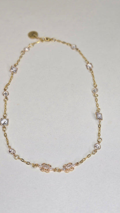 Floral Spark Zircon Necklace, gold-tone chain with zircon stones and a floral centerpiece