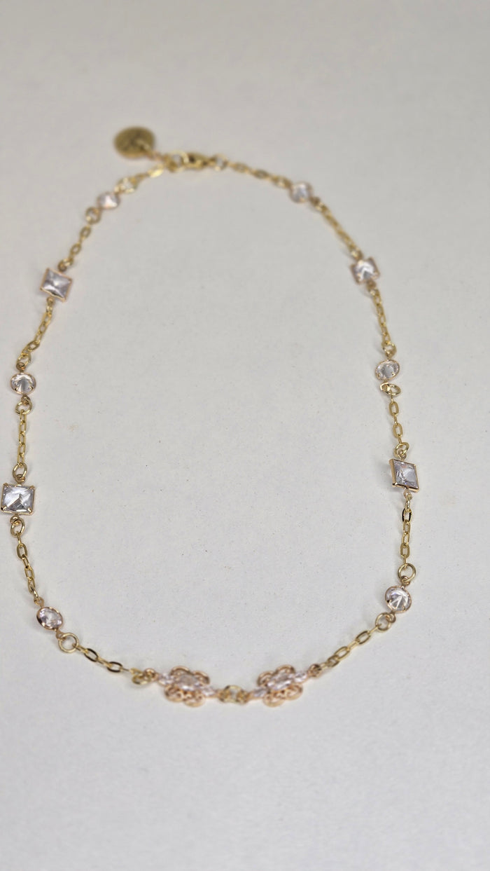 Floral Spark Zircon Necklace, gold-tone chain with zircon stones and a floral centerpiece