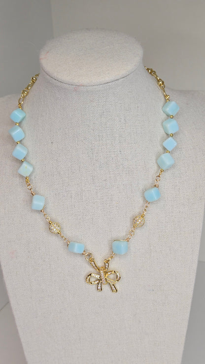 Blue Sky Ribbon Necklace with blue stone beads, zircon accents and a ribbon pendant, view 6