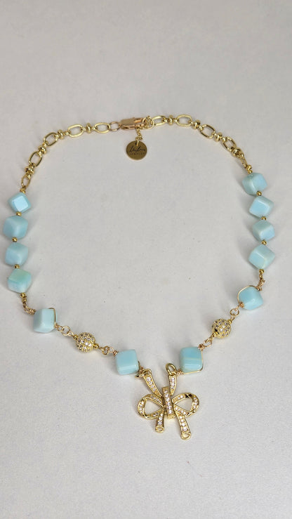 Blue Sky Ribbon Necklace with blue stone beads, zircon accents and a ribbon pendant, view 4