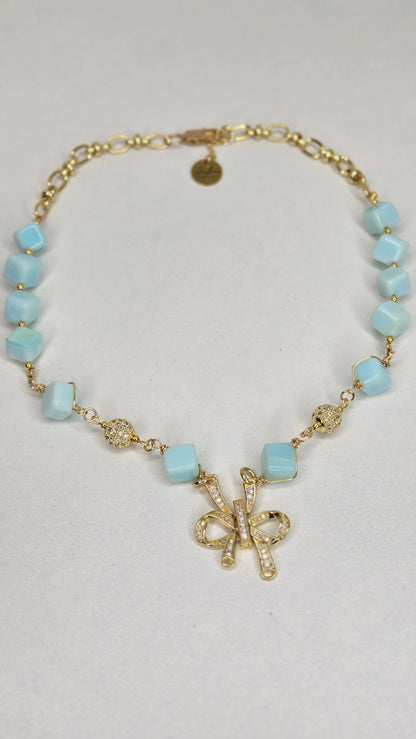 Blue Sky Ribbon Necklace with blue stone beads, zircon accents and a ribbon pendant, view 2