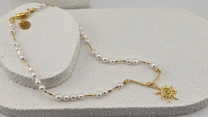 Pearl Sun Necklace with irregular white pearl beads and a gold-tone sun pendant, view 4