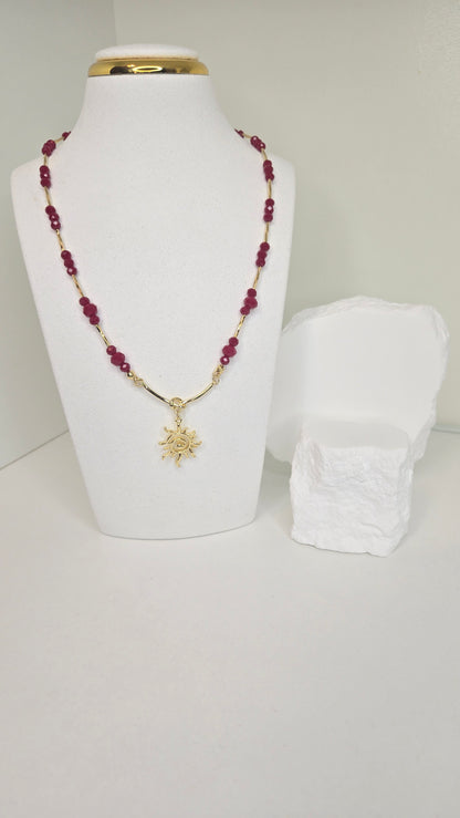 Sun of Love Necklace with faceted red gemstone beads and a gold-tone sun pendant, view 5