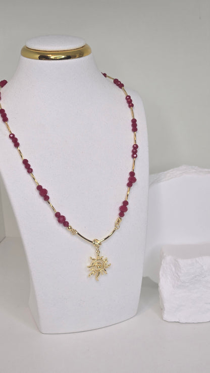 Sun of Love Necklace with faceted red gemstone beads and a gold-tone sun pendant, view 3