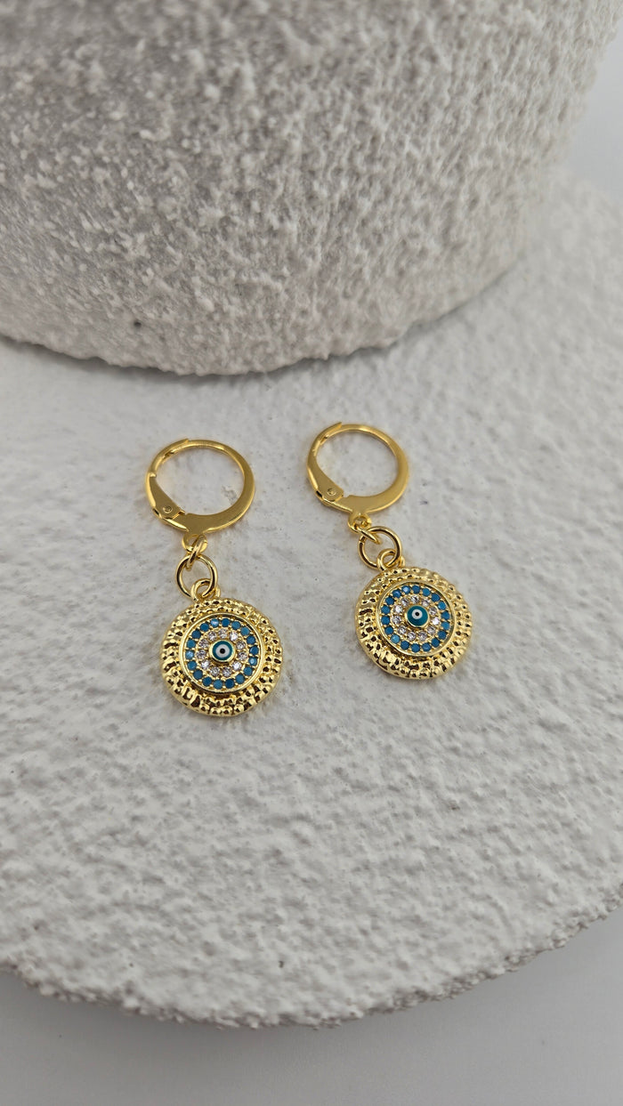 Royal Eye Earrings with round evil-eye design in turquoise-blue and clear stones, gold-tone frame