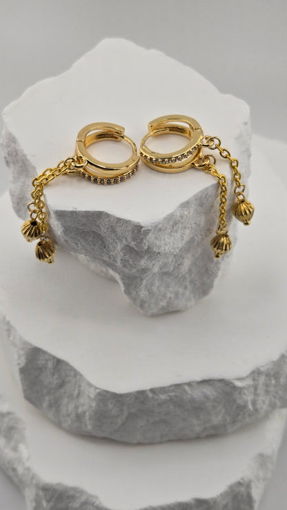 Dancing Gold Earrings with sparkling hoops and dangling gold-tone chains with textured charms, view 3