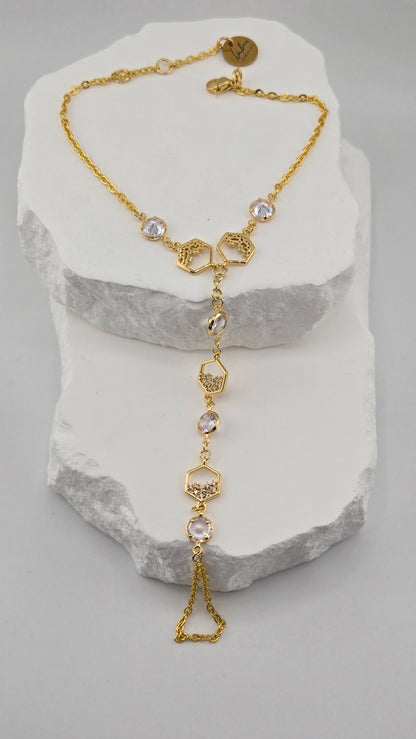 Honeycomb Crystal Hand Chain with gold-tone hexagonal details and clear stones