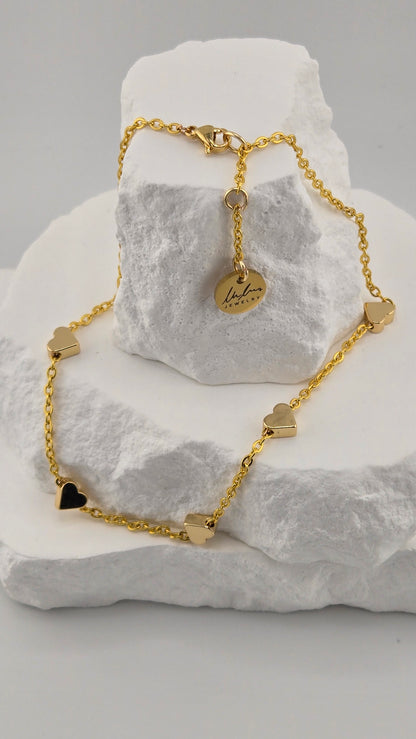 Golden Love Anklet with five polished hearts on a fine gold-tone chain