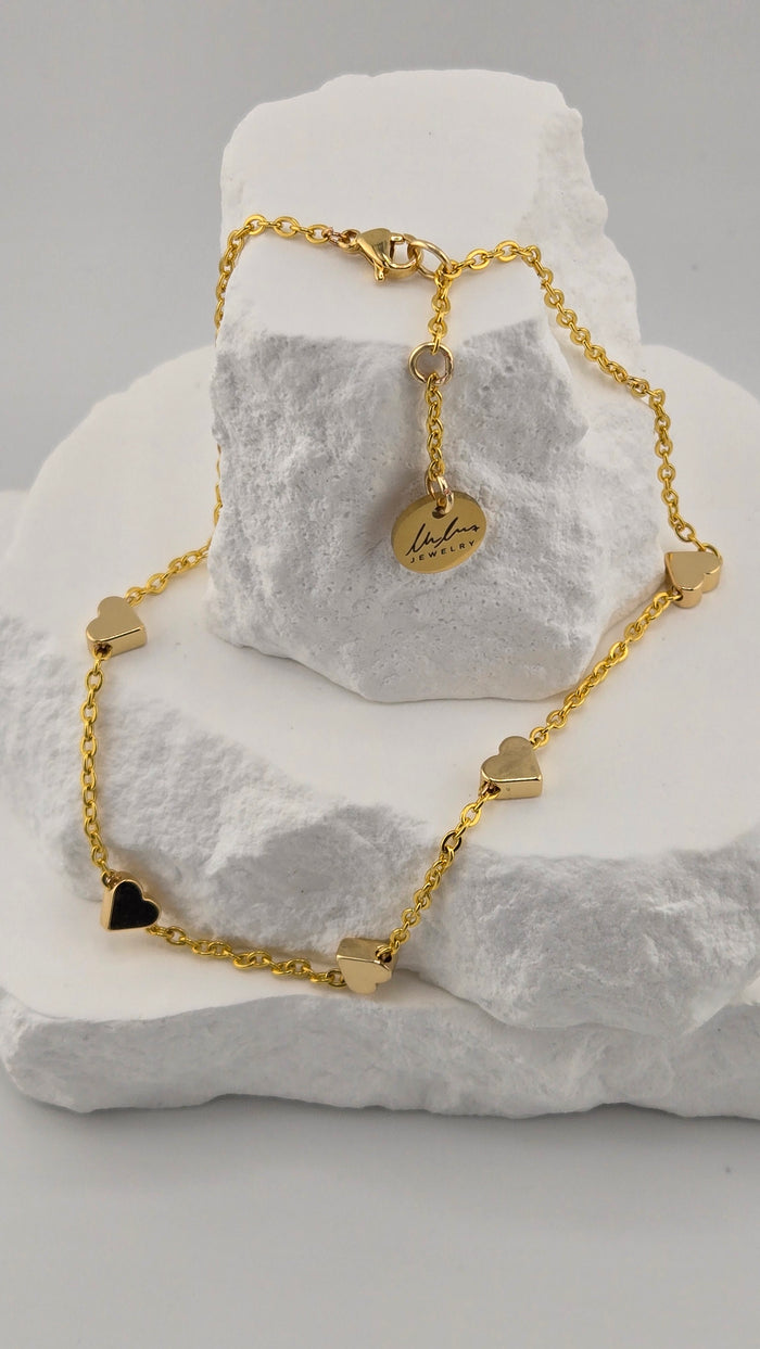 Golden Love Anklet with five polished hearts on a fine gold-tone chain