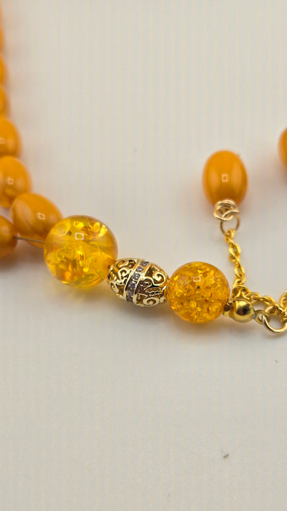 Golden Honey Tasbih with amber and honey-toned beads and ornate gold-tone spacers, view 10