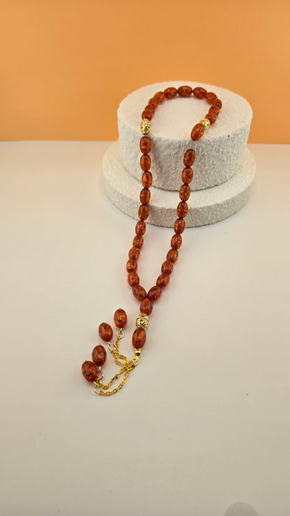 Golden Honey Tasbih with amber and honey-toned beads and ornate gold-tone spacers, view 5